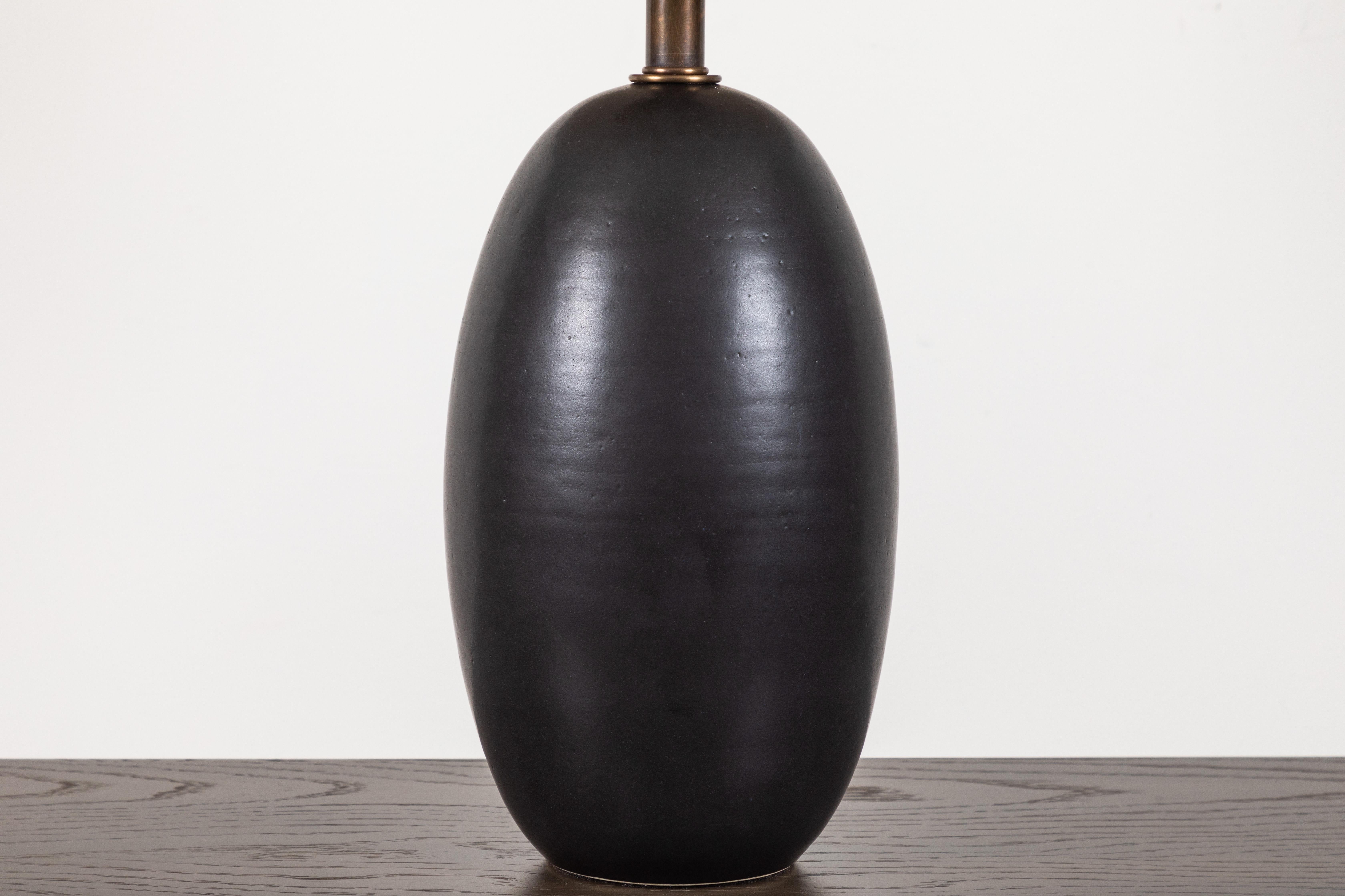 black pottery lamp