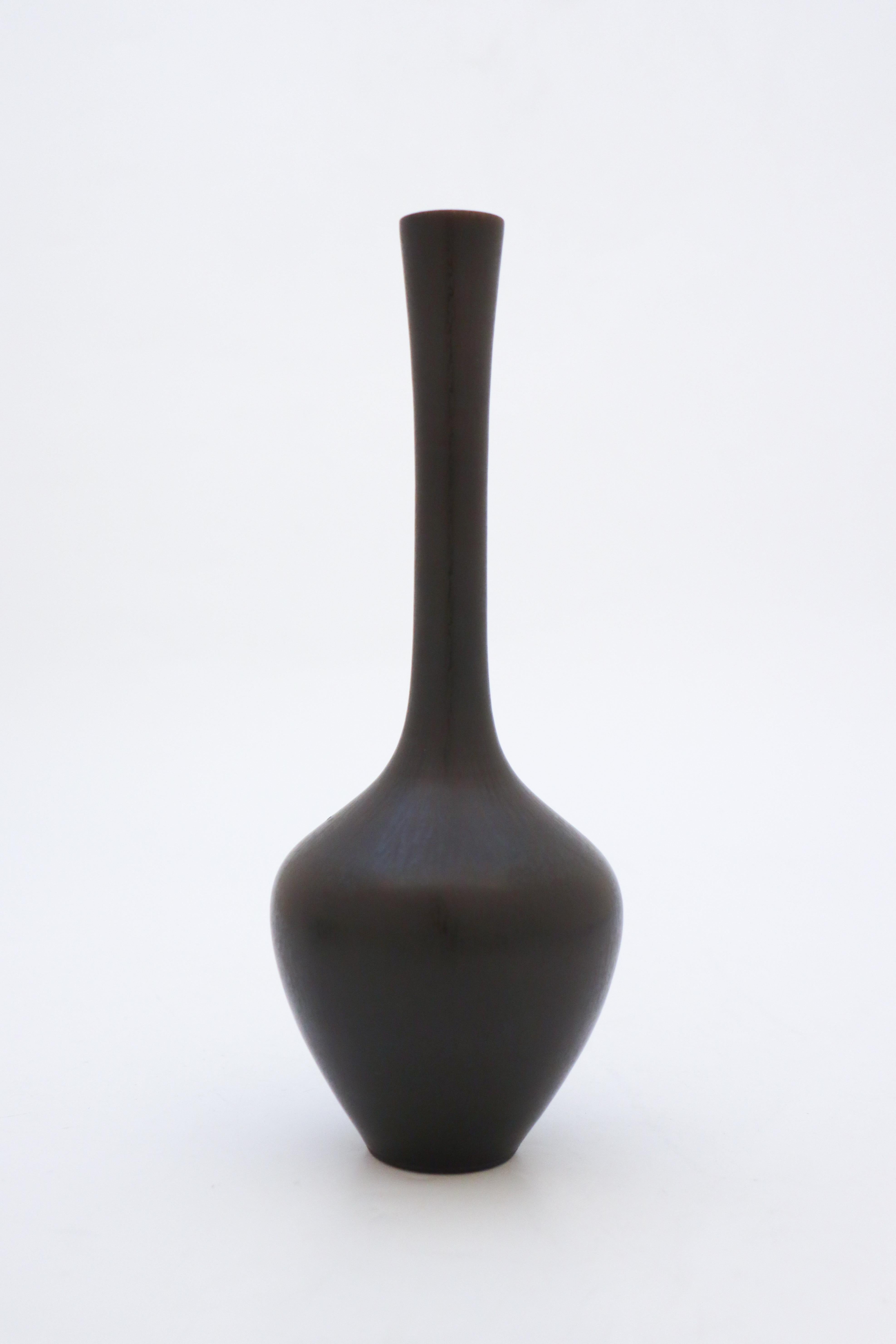 A lovely black vase designed by Berndt Friberg at Gustavsberg in Stockholm, the vase is 23.5 cm high with a lovely harfur glaze. It's marked as on picture and was made in 1953. It is in excellent condition.