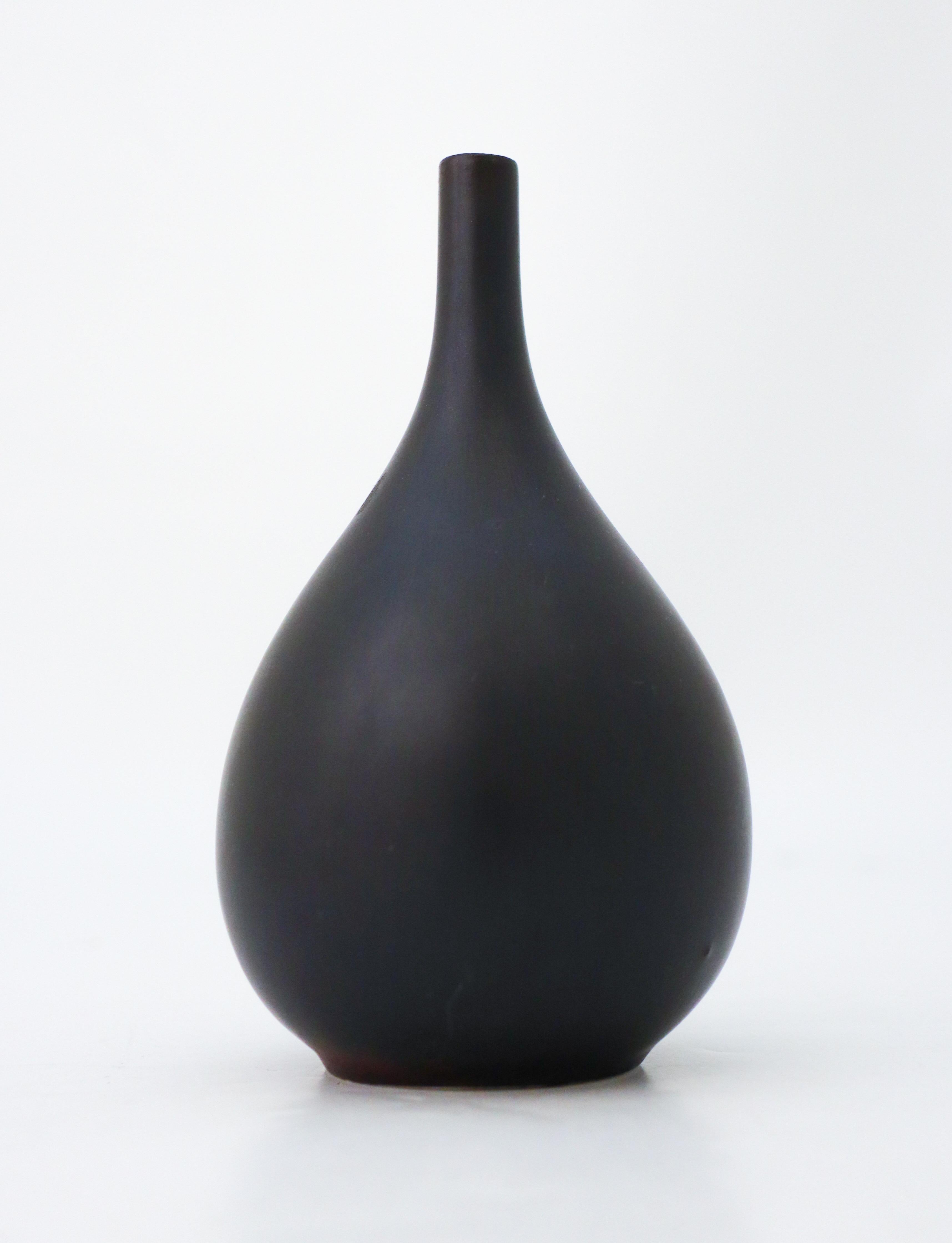 A black vase designed by Carl-Harry Stålhane at Rörstrand. The vase is 13.5 cm (5.4