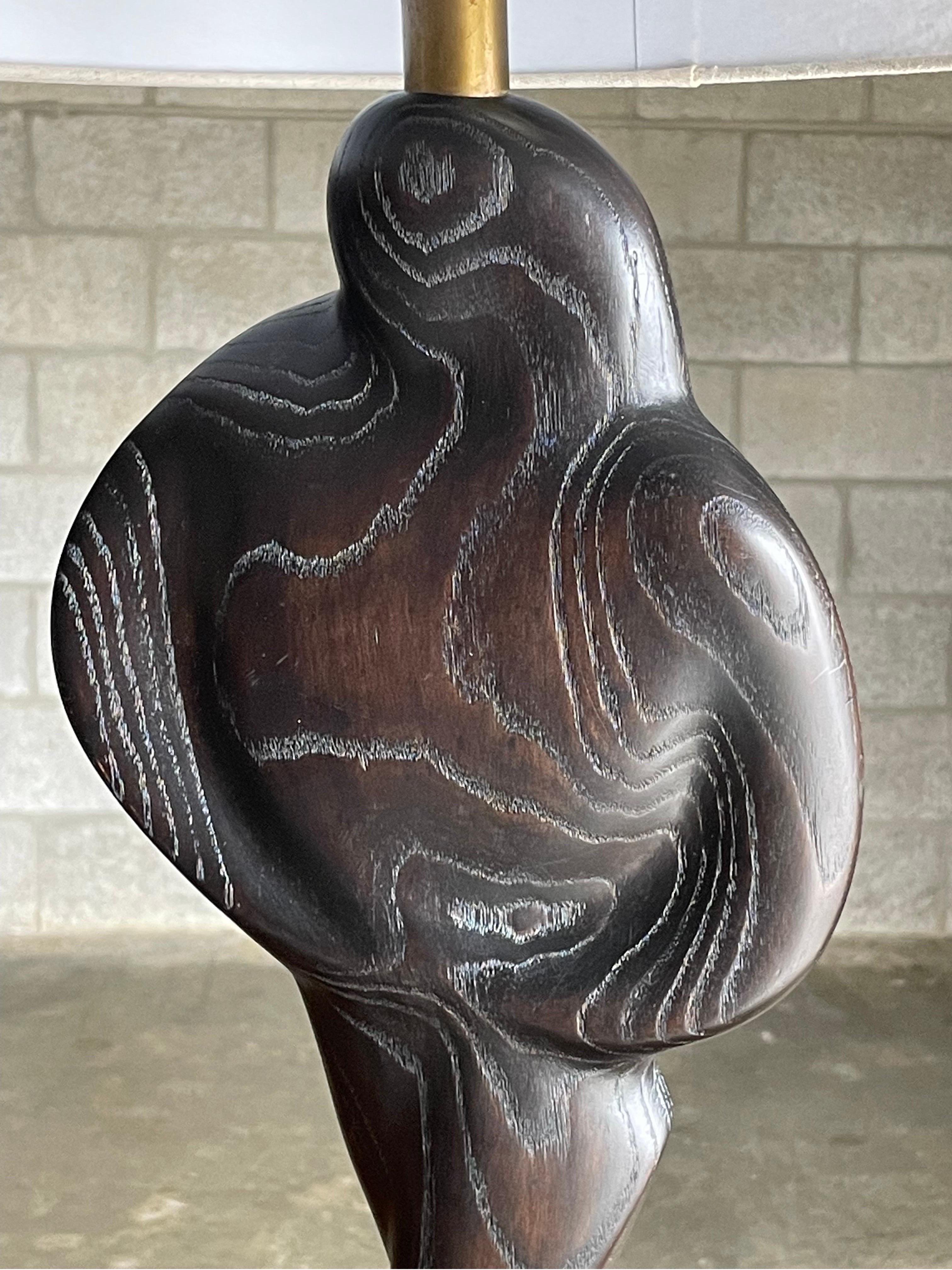 Sculptural figure table lamp in a black cerused finish attributed to Yasha Heifetz. Great scale and form with organic movement.

Measures: Overall 
29” tall
15” wide

Body
7” wide 
1.5” deep

Base 
9” wide 
6” deep.