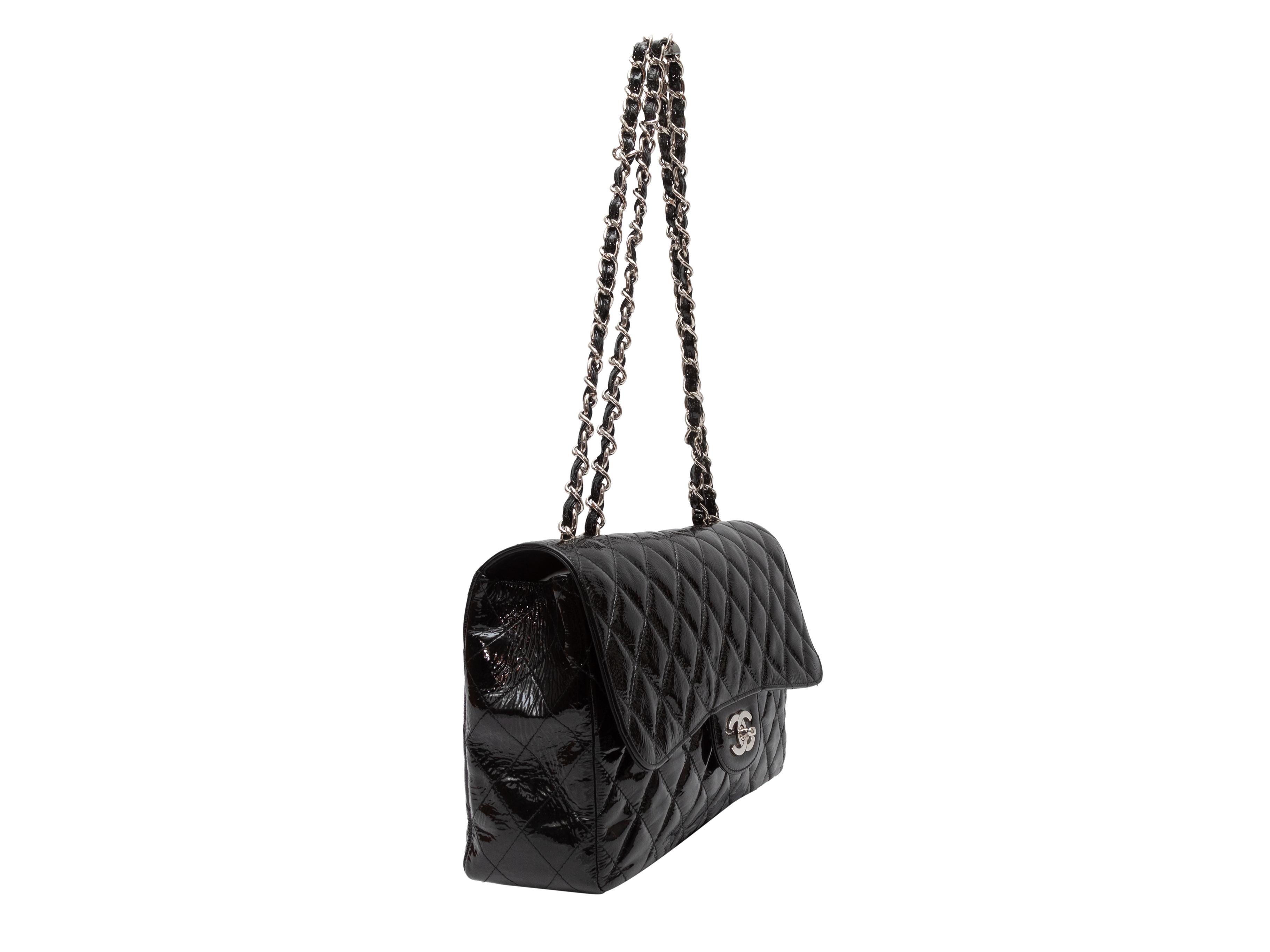 Black Chanel 2006-2009 Medium Timeless Classique Flap Bag. The Timeless Classique bag features a quilted patent leather body, silver-tone hardware, dual chain-link and leather shoulde straps, and a front CC turn-lock flap closure. 11.5