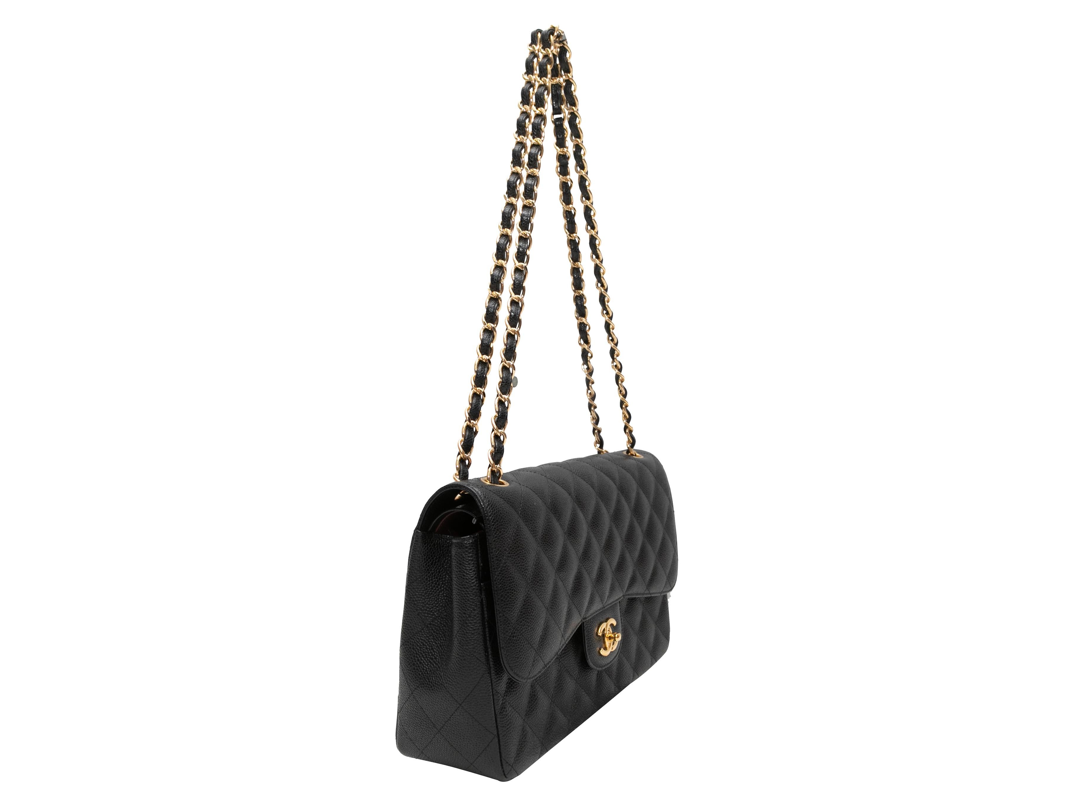 Black Chanel 2017 Classic Jumbo Caviar Double Flap Bag. The Classic Jumbo Double Flap Bag features a caviar leather body, gold-tone hardware, dual chain-link and leather shoulder strap, an exterior back pocket, and a front CC turn-lock flap closure.