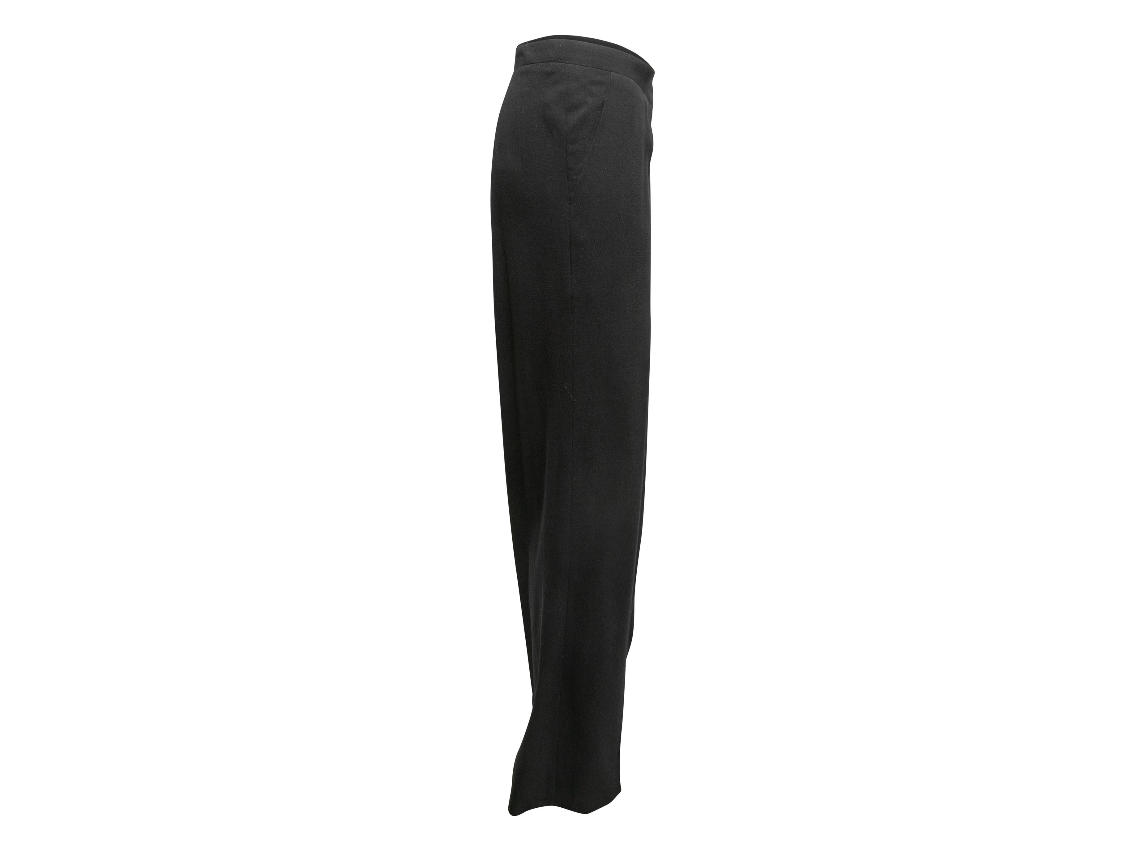 Black wool trousers by Chanel. From the Fall/Winter 2008 Collection. Dual hip pockets. Front zip closure. 40