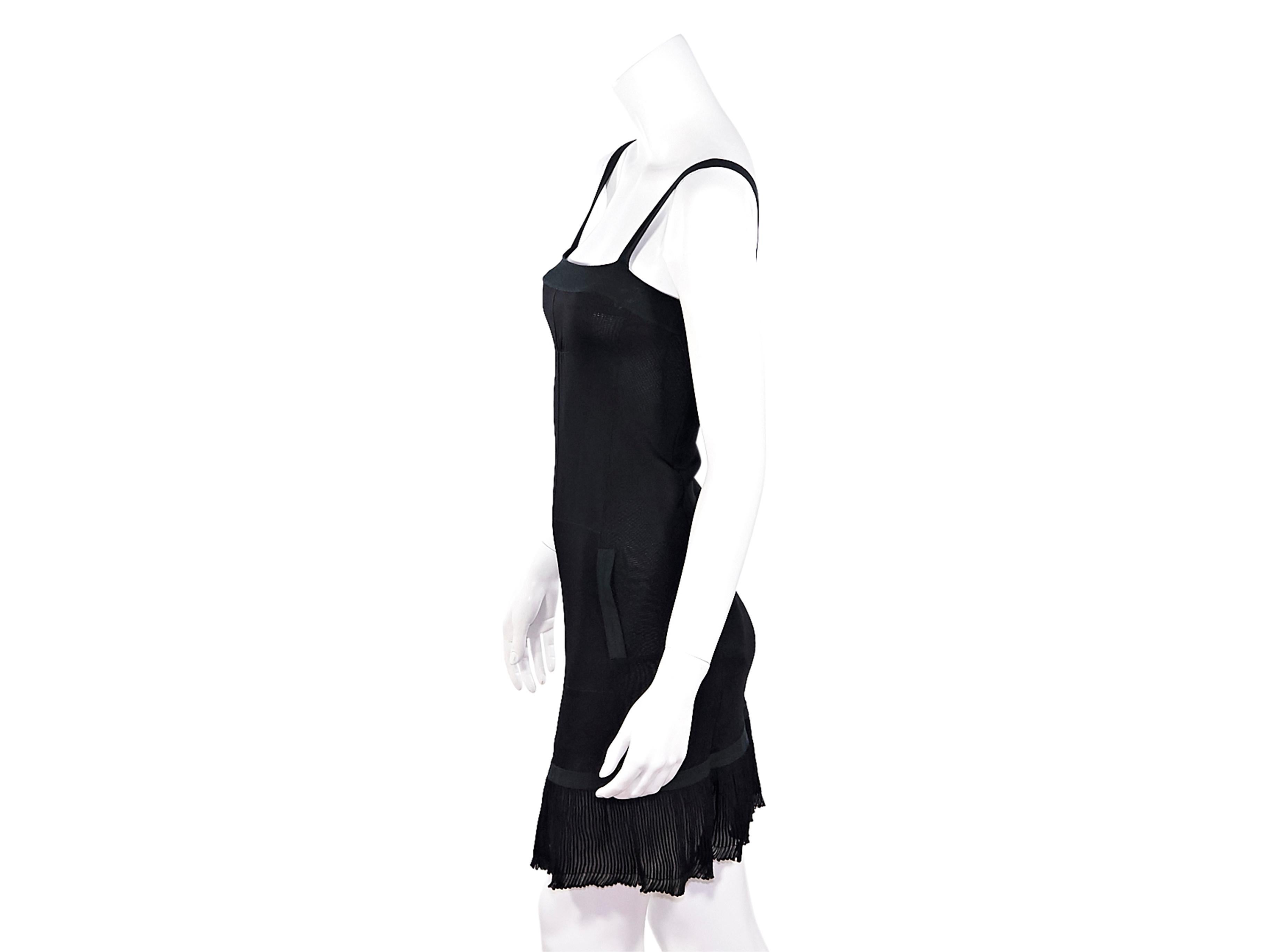 Product details:  Black knit tank dress by Chanel.  Sleeveless.  Waist slide pockets.  Pleated hem.  Pullover style.  Label size FR 36.  30