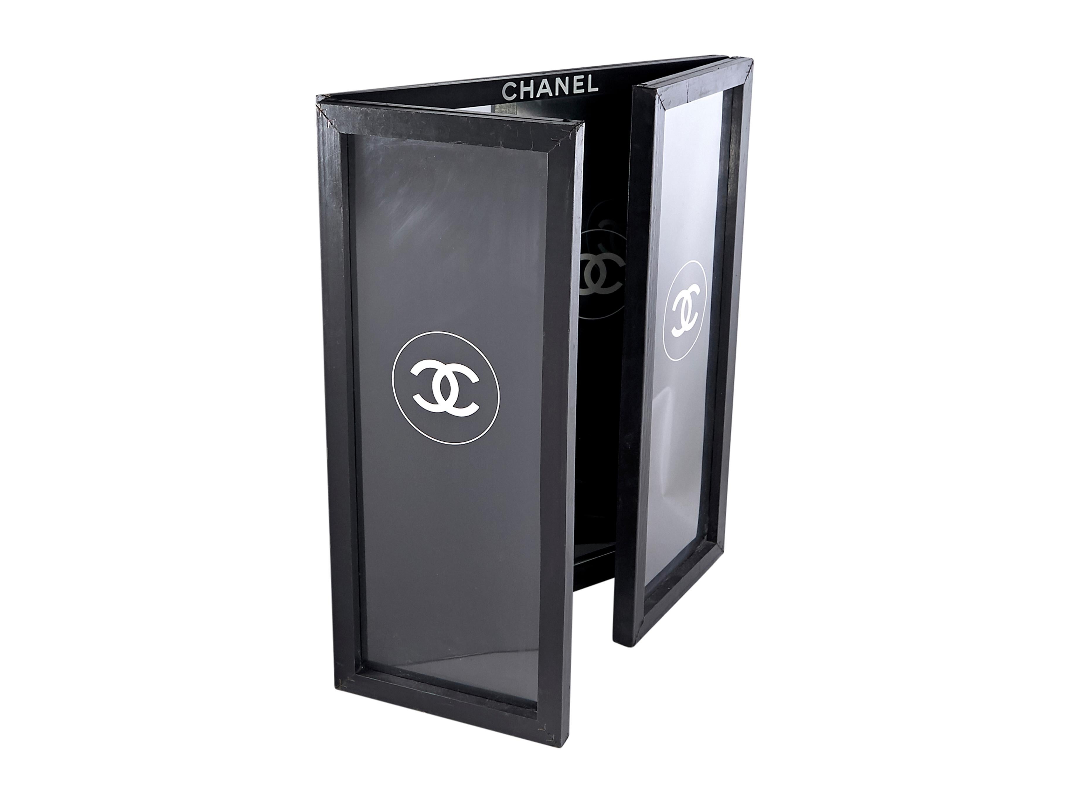 Product details: Black CC logo-accented bifold mirror by Chanel.  Contrast trim. Freshen your red lip in the reflective surface. Side Panels: 9