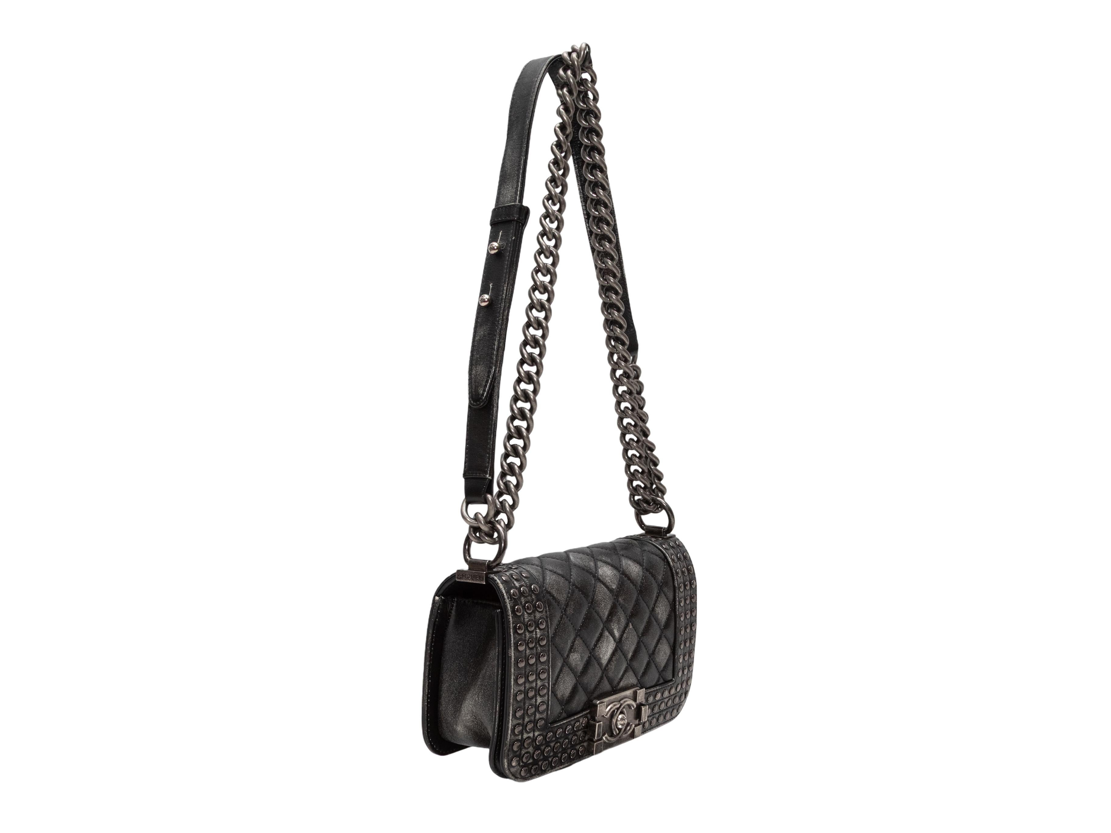 Black Chanel Paris-Dallas Small Studded Boy Bag. The Paris-Dallas Small Studded Boy Bag features a brushed leather body, silver-tone hardware, dual chain-link and leather straps, and a front CC flap closure. 8