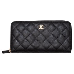 Portefeuille continental en cuir caviar matelassé noir de Chanel