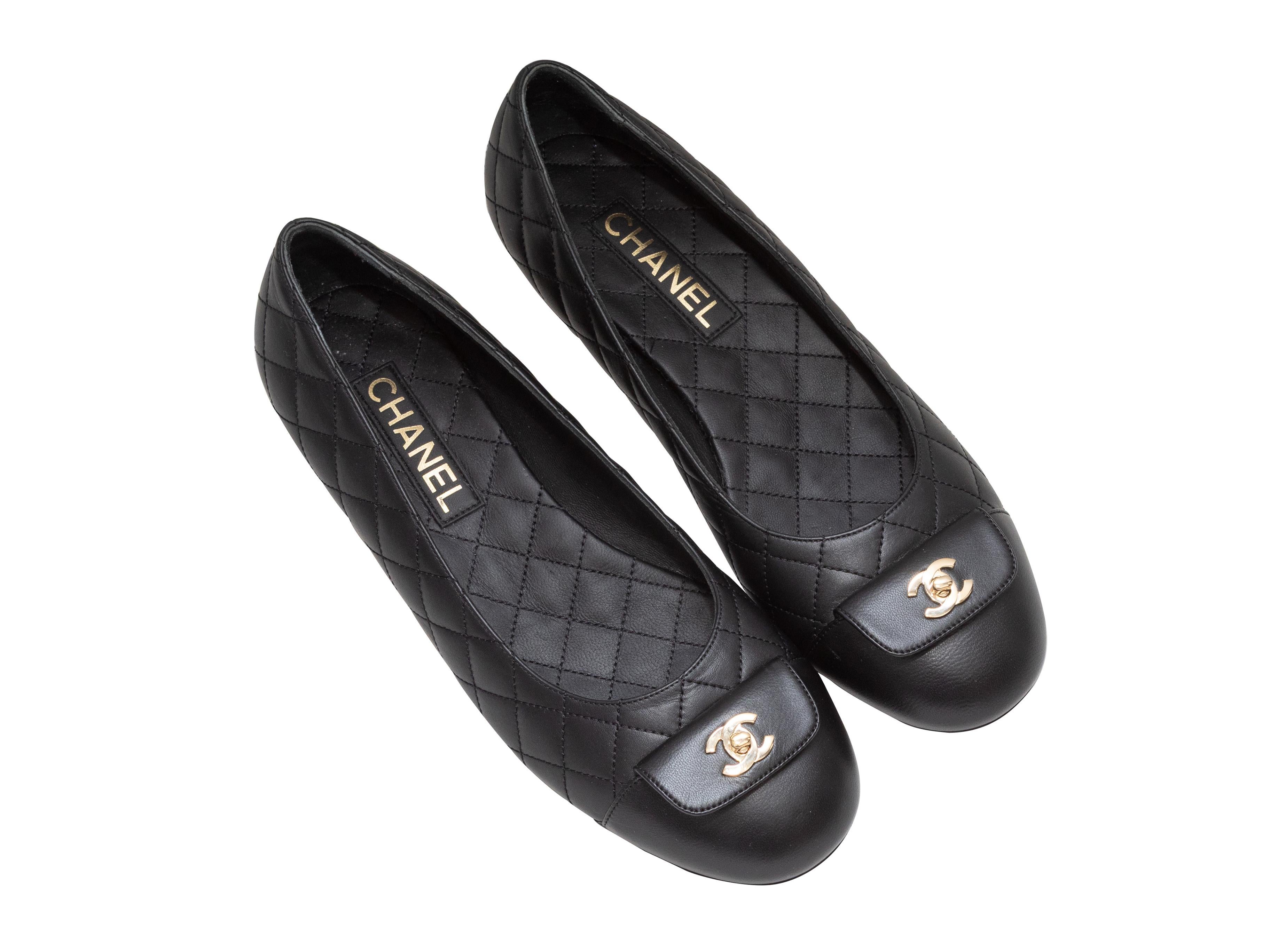 Black quilted leather CC ballet flats by Chanel. Gold-tone hardware at tops. 0.5