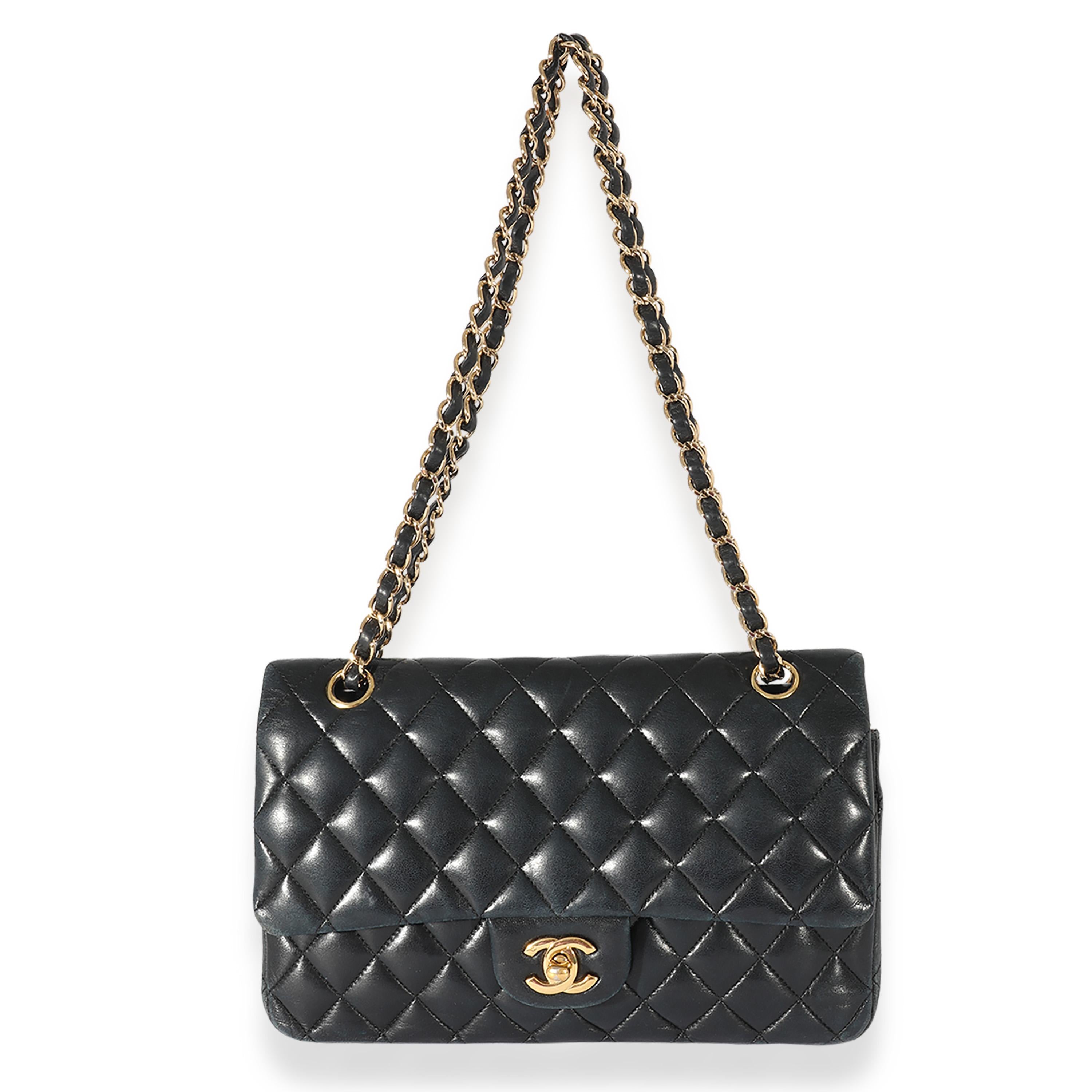 Listing Title: Black Chanel Quilted Lambskin Medium Classic Double Flap Bag
SKU: 125099
Condition: Pre-owned 
Handbag Condition: Fair
Condition Comments: Fair Condition. Heavy scuffing to corners and throughout exterior. Discoloration to lambskin.