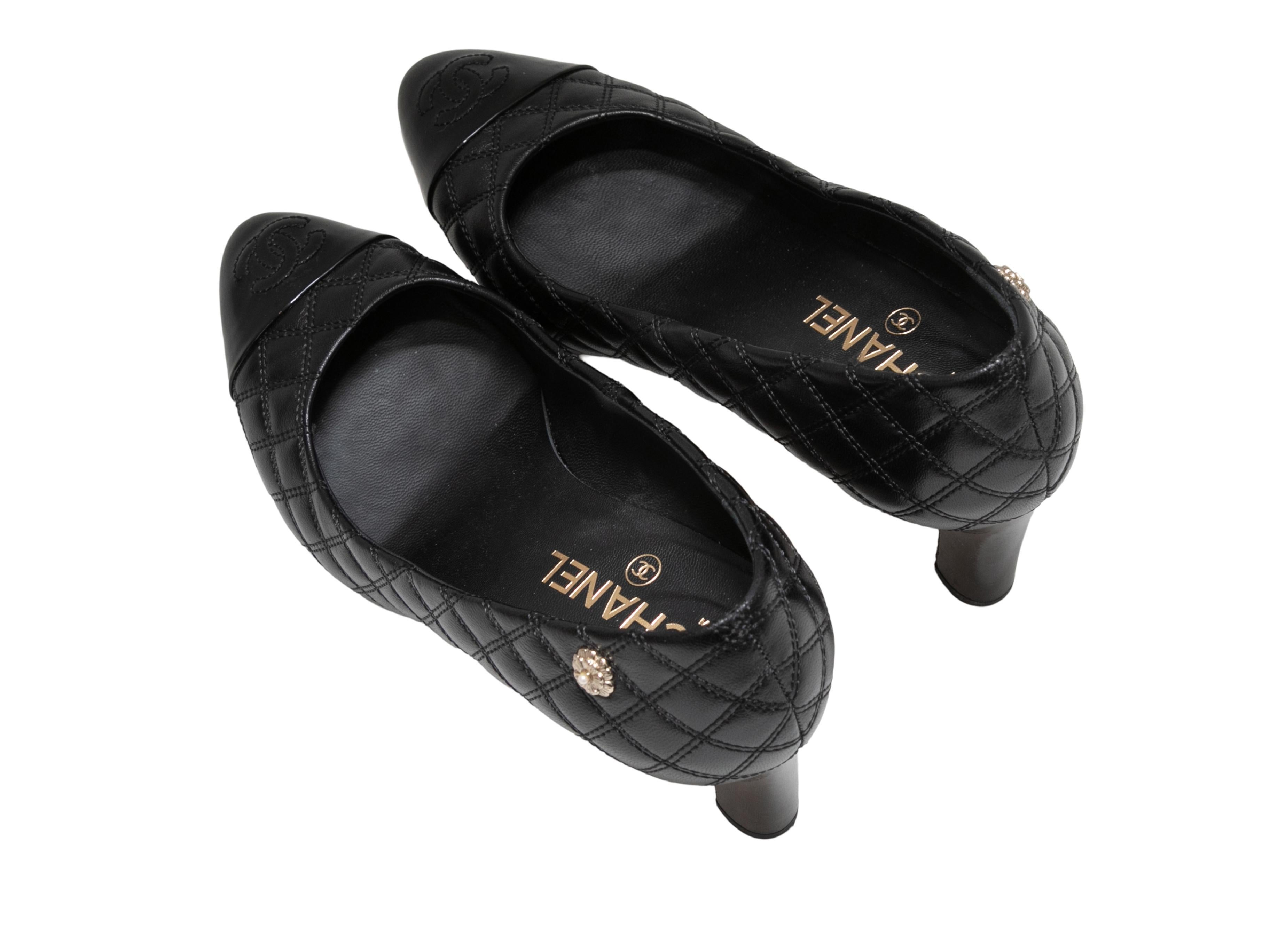 Black quilted lambskin and patent leather pointed cap-toe pumps by Chanel. 3