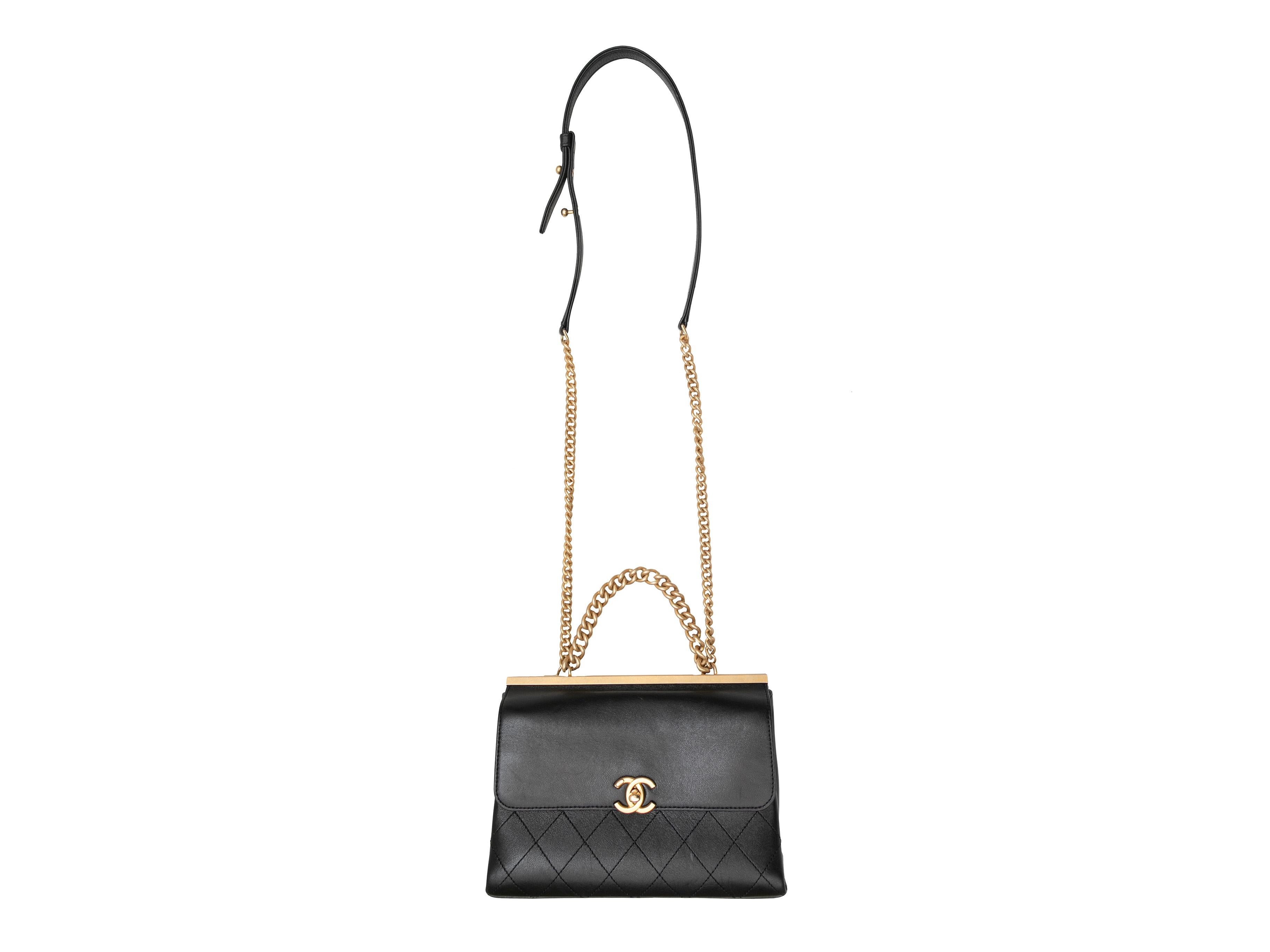 Product Details: Black Chanel Small Coco Luxe Bag. The Small Coco Luxe Bag features a lambskin body, gold-tone hardware, chain-link and leather strap, and a front turn-lock CC closure. 9.25
