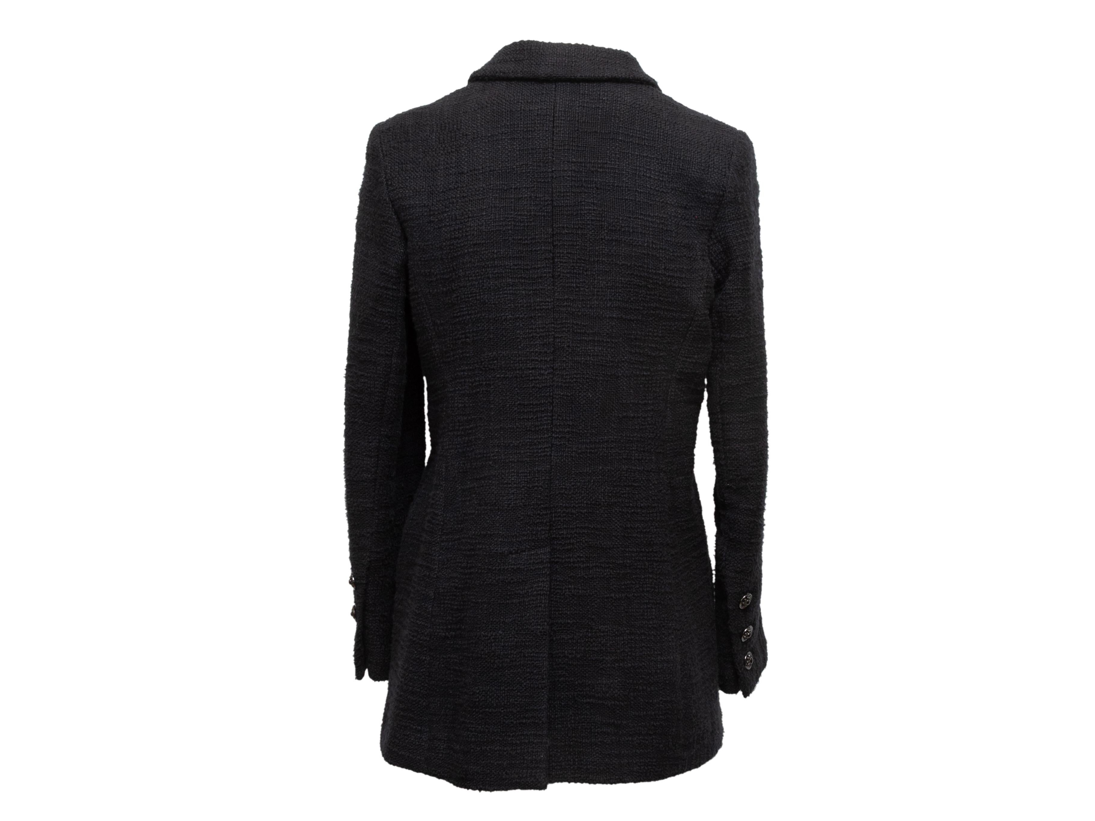 Black cotton tweed blazer by Chanel. From the Spring 2000 Collection. Notched lapel. Three welt pockets. Button closures at center front. Designer size 38. 36
