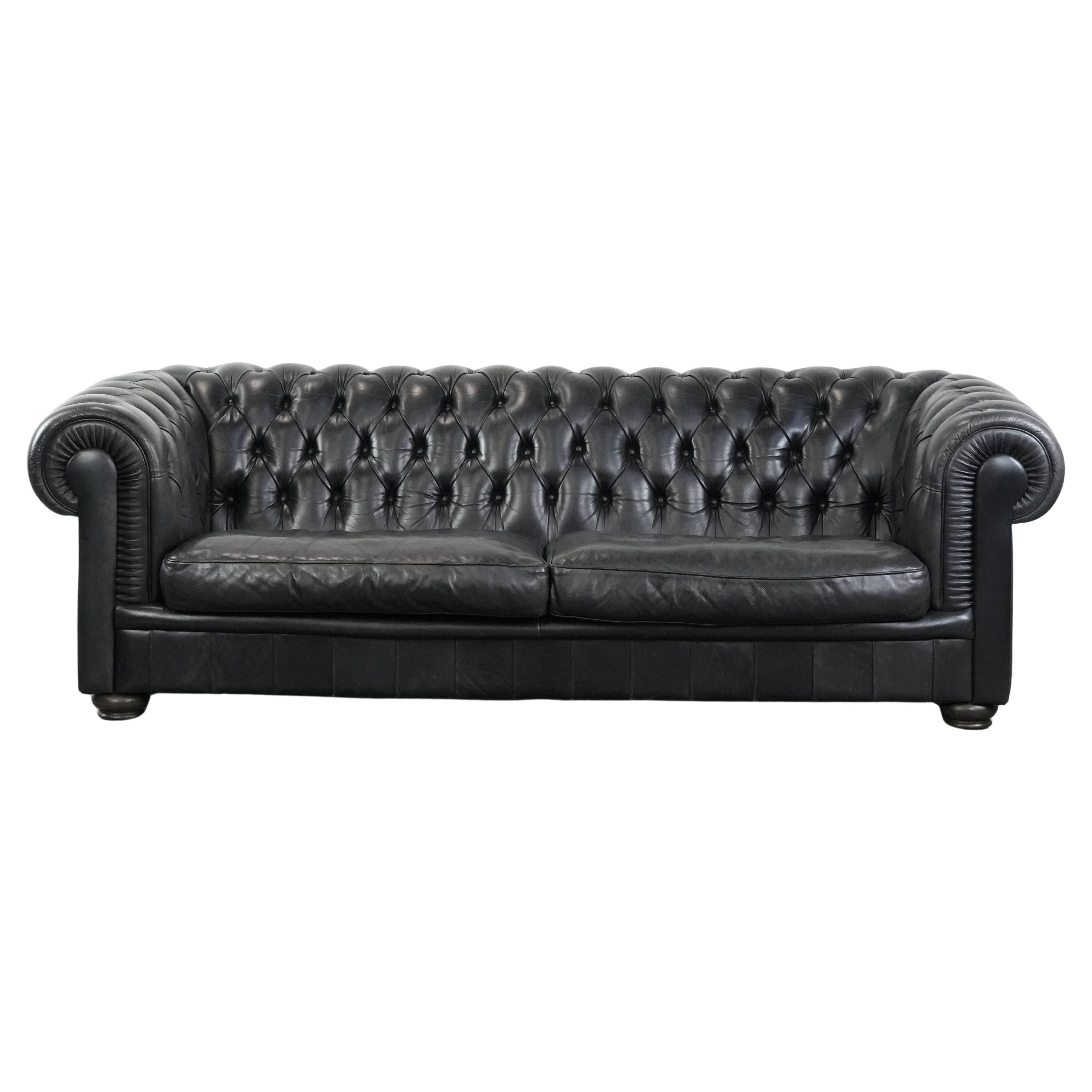 Black chesterfield 3-seater sofa made of cowhide leather in English style