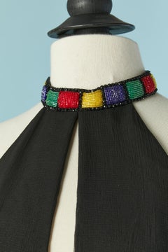 Black chiffon evening jumpsuit with embroideries and beadwork.