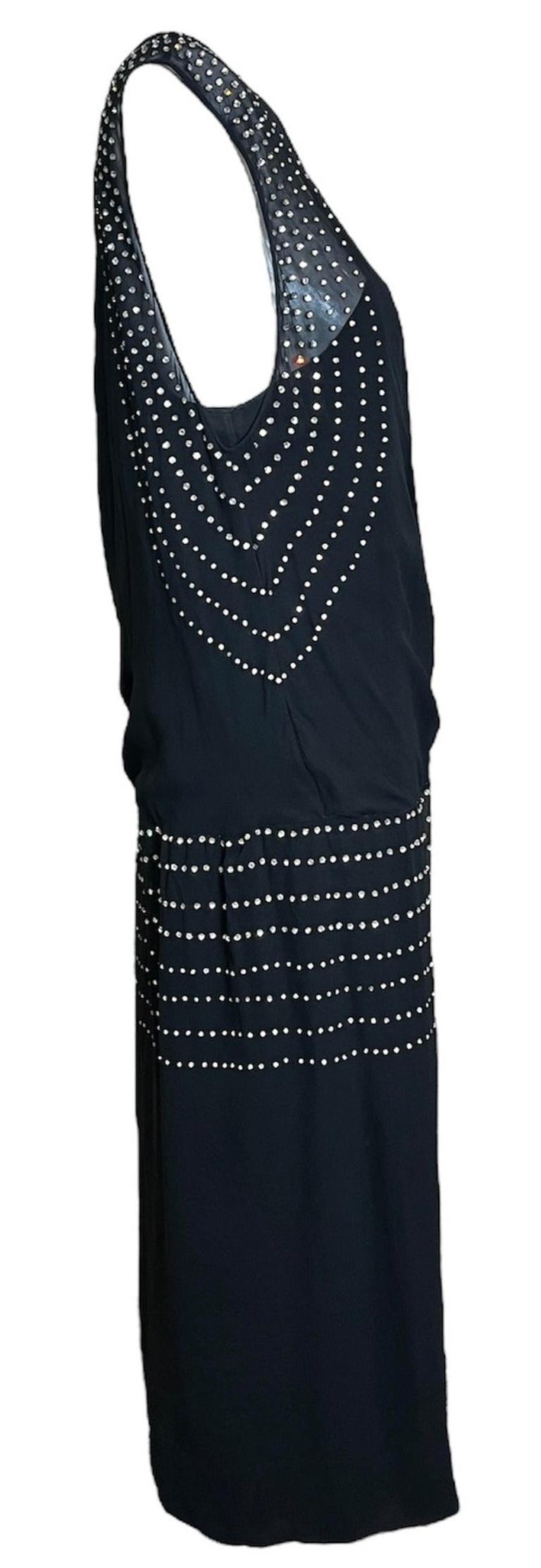 1920s flapper dress in black silk chiffon with built in silk crepe slip. Drop waisted and sheer - this would make for an elegant Theda Bara moment. The studded rhinestone accents gives the dress some darling deco vibes. In amazingly excellent