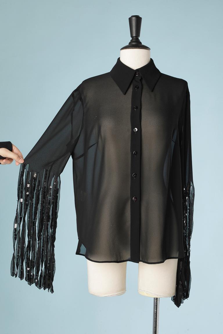 See- through black chiffon shirt with franges on the sleeves and sequin embroderies. 
Size 46 (It) 42 (Fr) L 