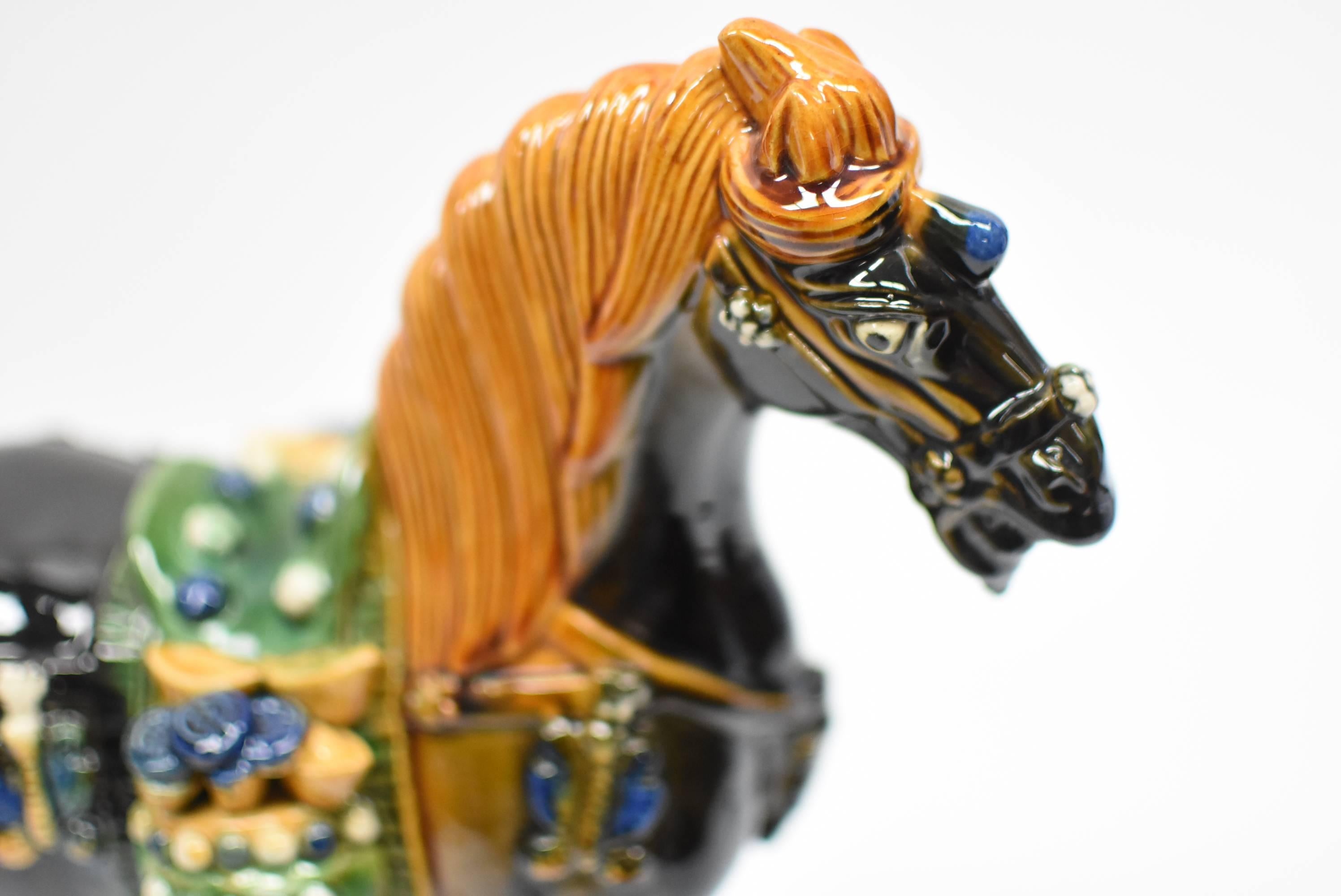 A beautiful black, San Cai horse in high gloss. The Sancai technique dates back to the Tang dynasty (618–907AD). This wonderful piece has all the hallmarks of Tang San Cai terracotta potteries with skillfully applied glaze achieving amazing artistic