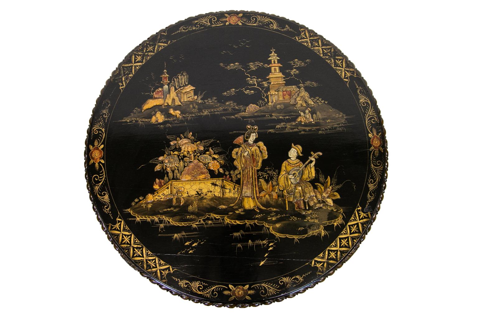 This coffee table is decorated with Chinoiserie figures raised in three dimensional relief depicting musicians, court figures, bridges, islands, and houses. The border has a carved gadrooned edge molding and has a two inch border band painted with