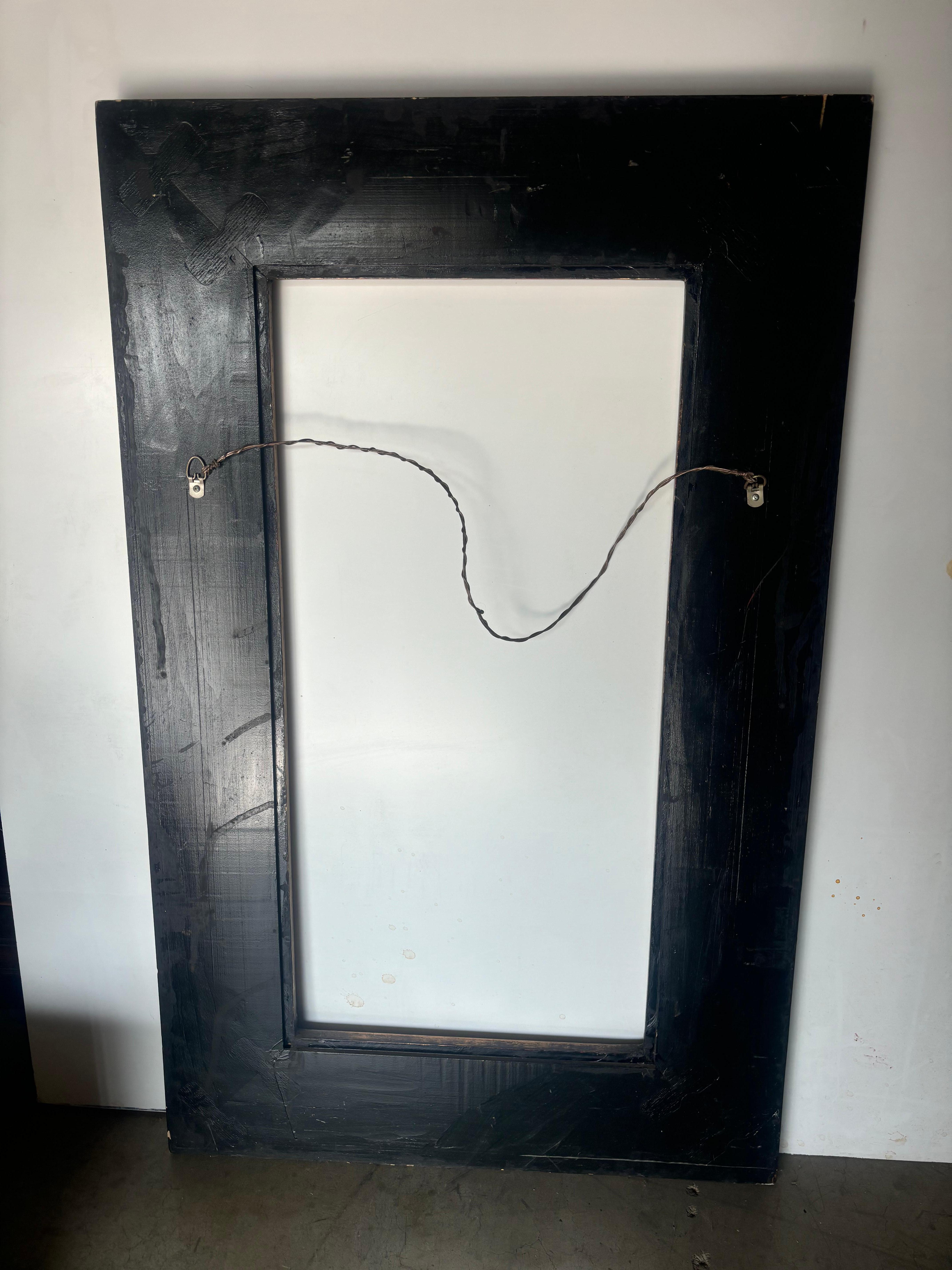 Concave Frame and Mirror, Gold and Black figures of traditional serene garden motif with pagodas, palms and bamboo that pop. 
Bow ties on the frame keep it solid