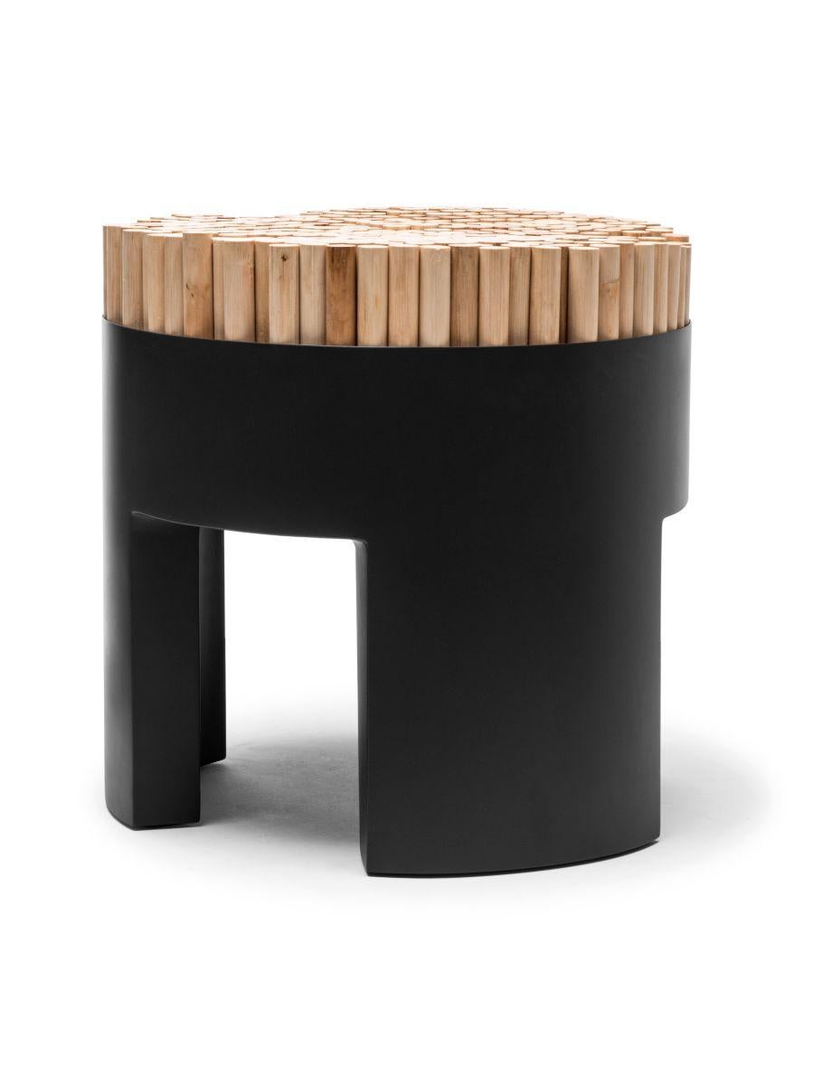Chiquita black stool by Kenneth Cobonpue
Materials: Rattan, Polyurethane foam, steel. 
Dimensions: Diameter 45 cm x height 46cm 

Chiquita is a bundle of charms with its clever design and functionality. The Chiquita stool’s vertical sections of