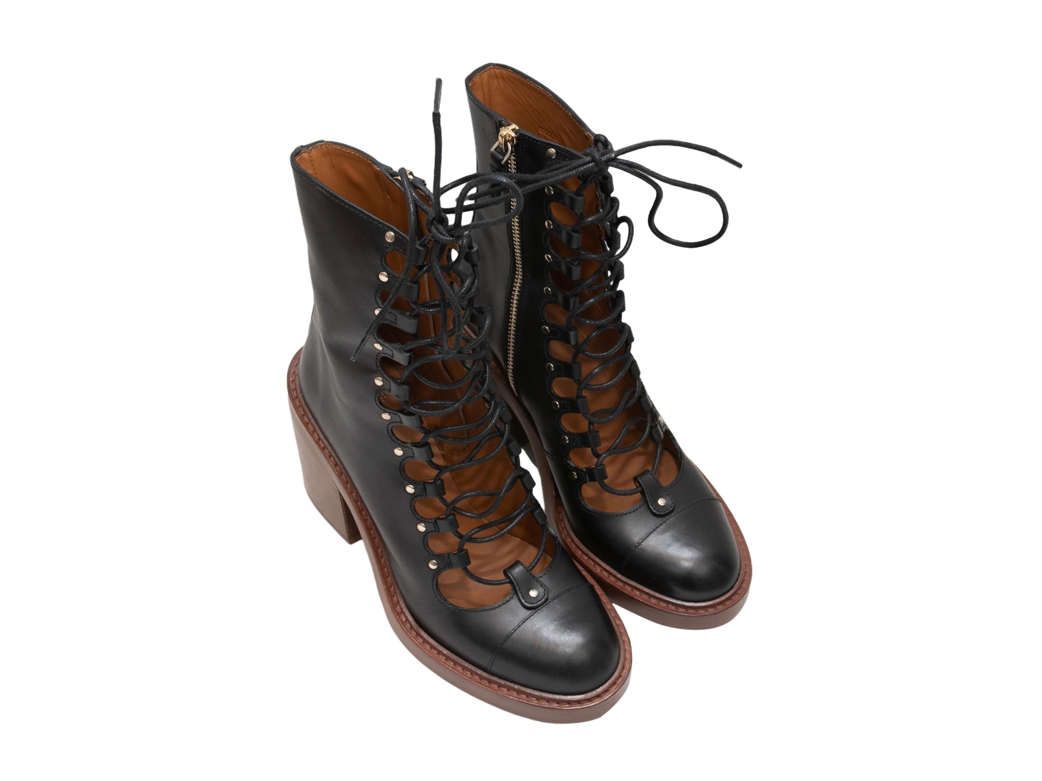 Black leather lace-up May ankle boots by Chloe. Stacked heels. Zip closures at inner sides. 5.75