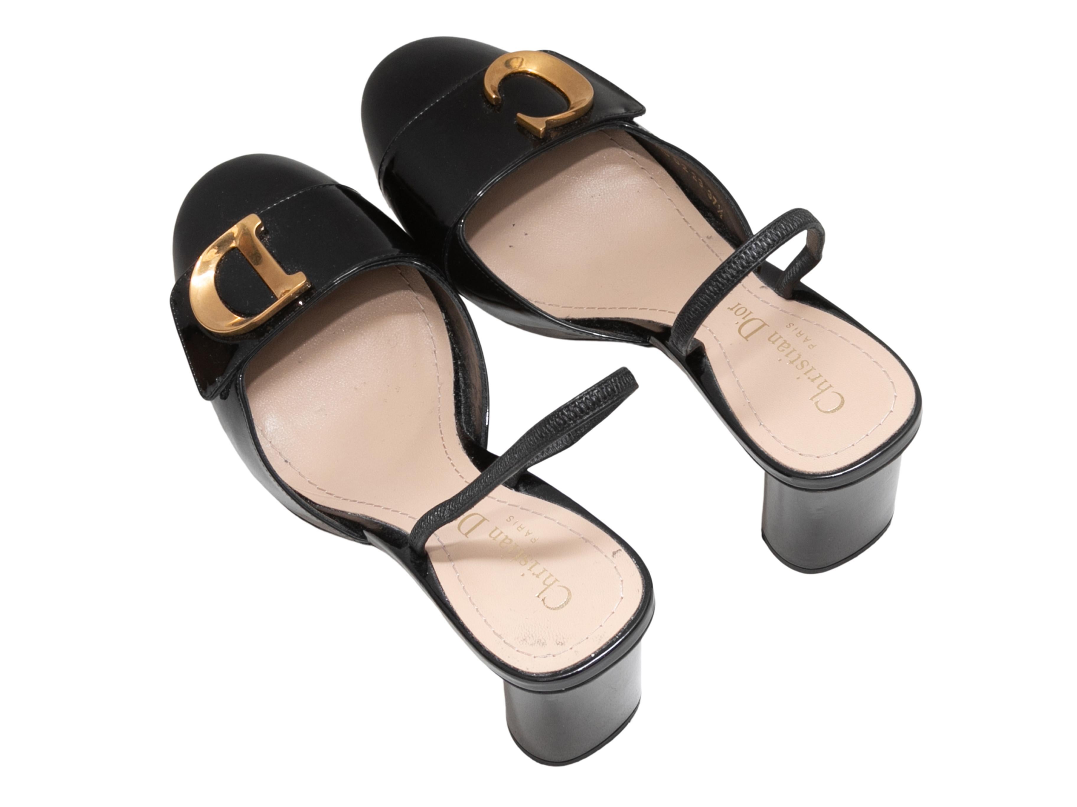 Black patent leather C'est Dior slingback heels by Christian Dior. Gold-tone logo hardware at tops. Block heels. 3
