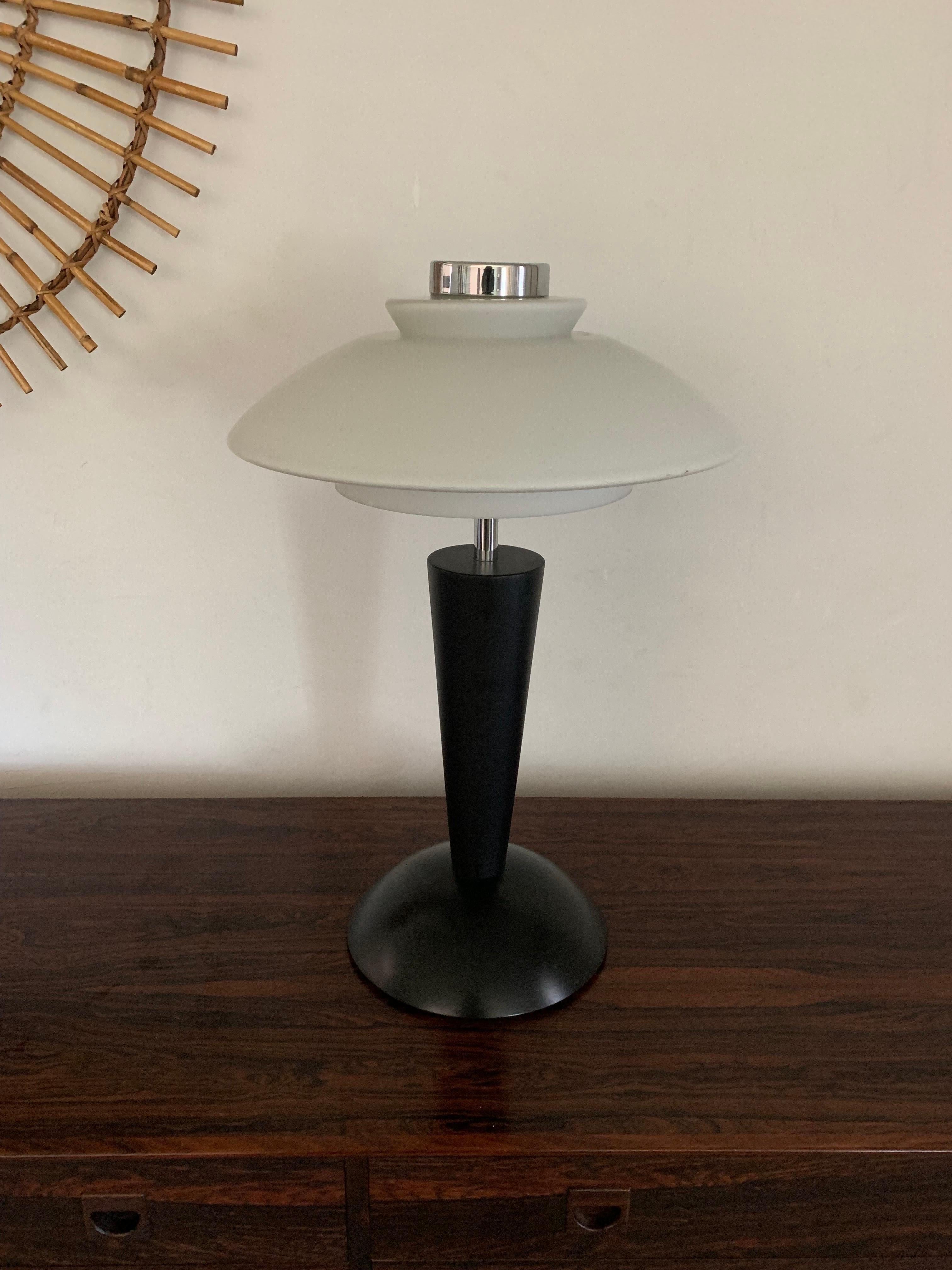 A Peill and Putzler table lamp. Similar in design to Poul Henningsen. 

Featuring a black base, chrome hardware and a thick white frosted glass shade. Lamp is well made and heavy. Has a dial for 3 separate lighting settings. 

Lamp is 
16” wide
16”