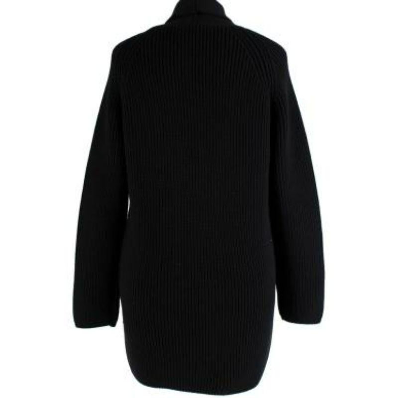 Bottega Venta Black Chunky Knit Cardigan
 
 
 
 - Heavy knit body 
 
 - Lapel collar 
 
 - Embossed black front button stand 
 
 - Long sleeve 
 
 - Two patch pockets 
 
 
 
 Materials:
 
 97.5% Wool
 
 2% Polyamide 
 
 0.5% Elastane 
 
 
 
 Made in