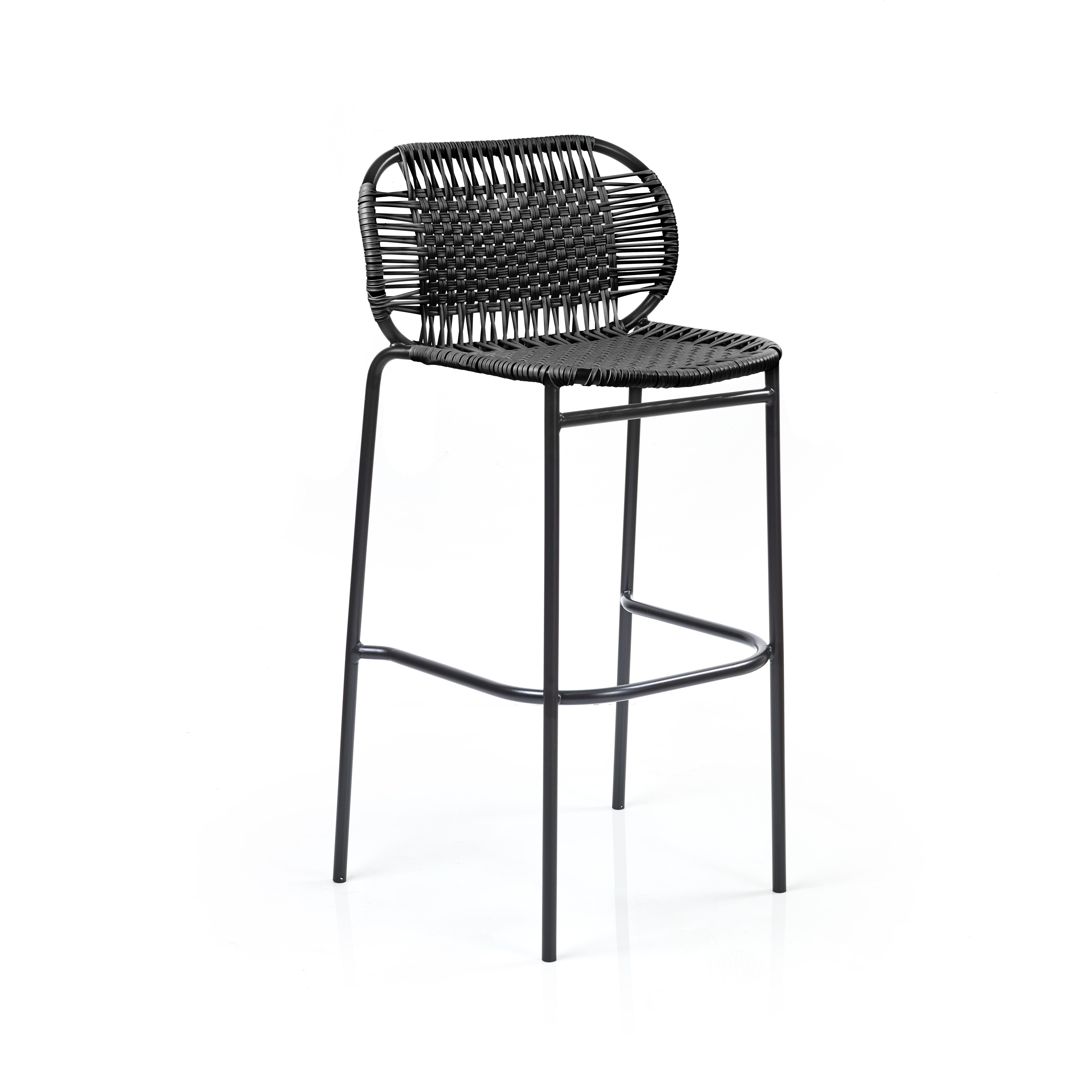 Black Cielo bar stool by Sebastian Herkner
Materials: Galvanized and powder-coated tubular steel. PVC strings are made from recycled plastic.
Technique: Made from recycled plastic and weaved by local craftspeople in Cartagena, Colombia. 
Dimensions: