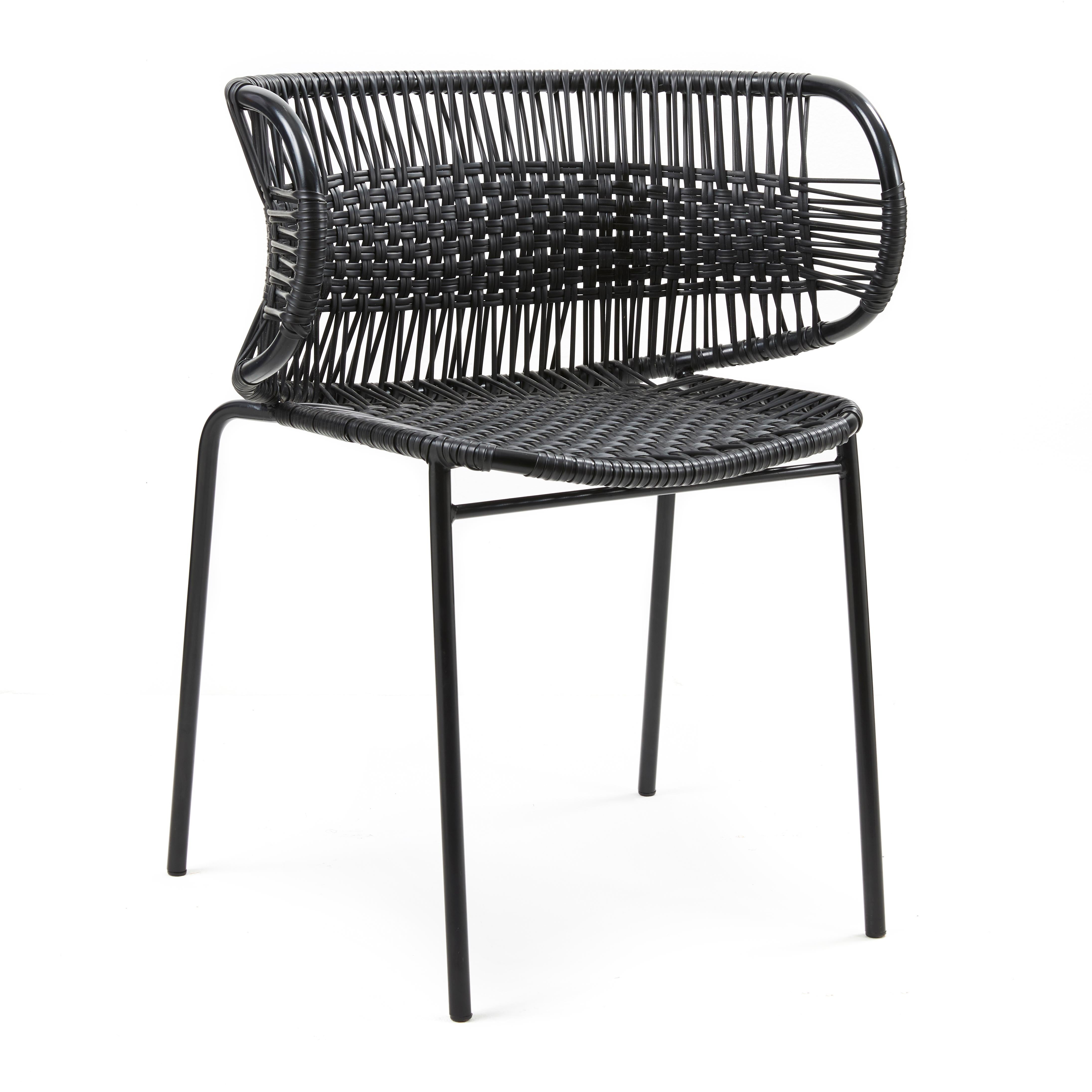 Black Cielo stacking chair with armrest by Sebastian Herkner.
Materials: Galvanized and powder-coated tubular steel. PVC strings are made from recycled plastic.
Technique: made from recycled plastic and weaved by local craftspeople in Cartagena,