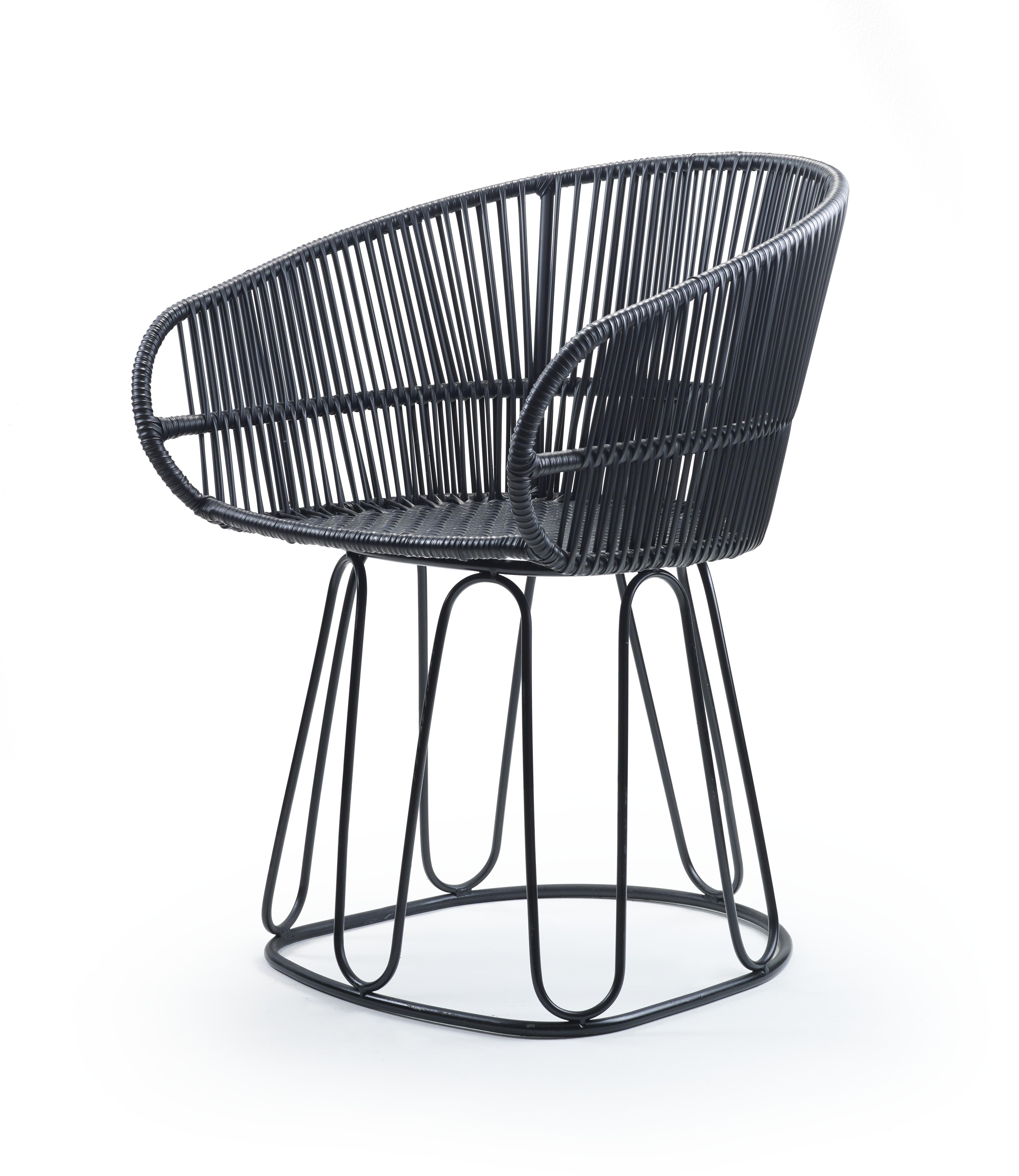 Black circo dining chair by Sebastian Herkner
Materials: Galvanized and powder-coated tubular steel. PVC strings.
Technique: Made from recycled plastic. Weaved by local craftspeople in Colombia. 
Dimensions: W 61.5 x D 56.5 x H 77.5 cm