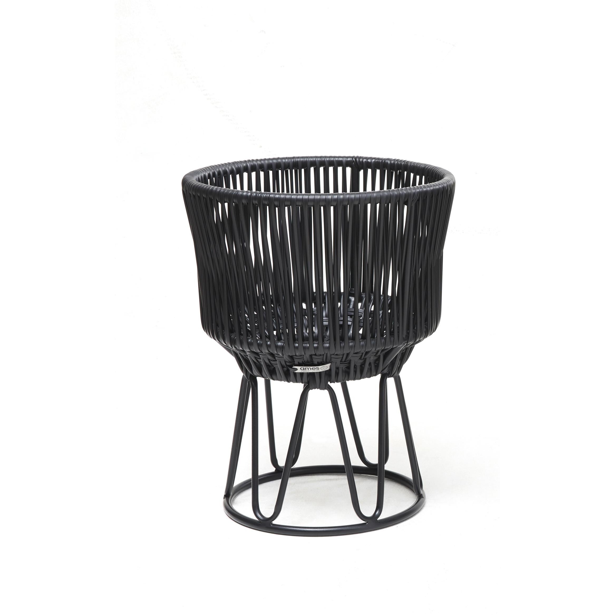 Black circo flower pot 1 by Sebastian Herkner.
Materials: Galvanized and powder-coated tubular steel. PVC strings.
Technique: Made from recycled plastic. Weaved by local craftspeople in Colombia. 
Dimensions: 
Top diameter 36 x height 48 cm