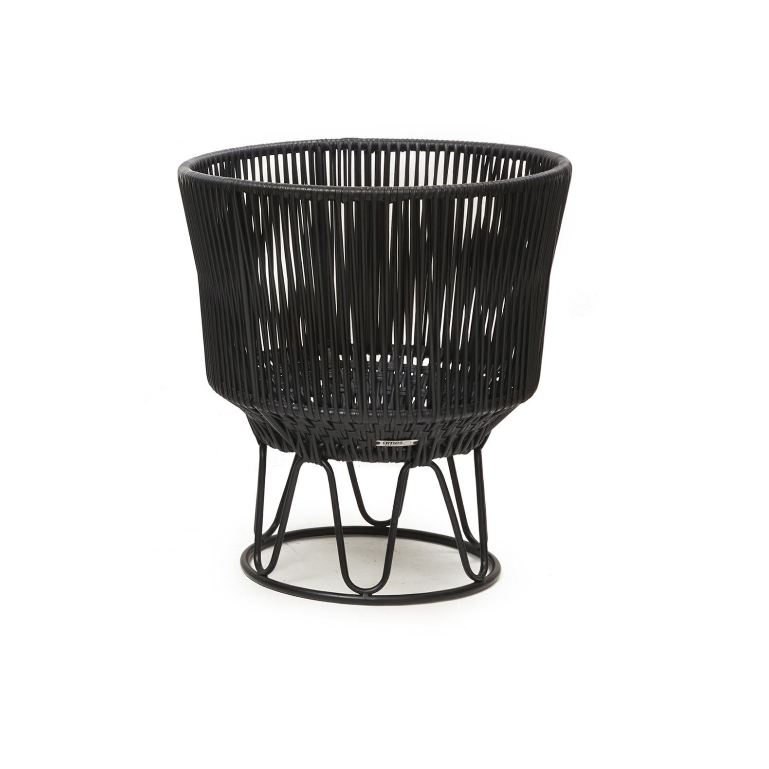 Black Circo flower pot 3 by Sebastian Herkner.
Materials: Galvanized and powder-coated tubular steel. PVC strings.
Technique: Made from recycled plastic. Weaved by local craftspeople in Colombia. 
Dimensions: 
Top diameter 50 x height 56.5 cm