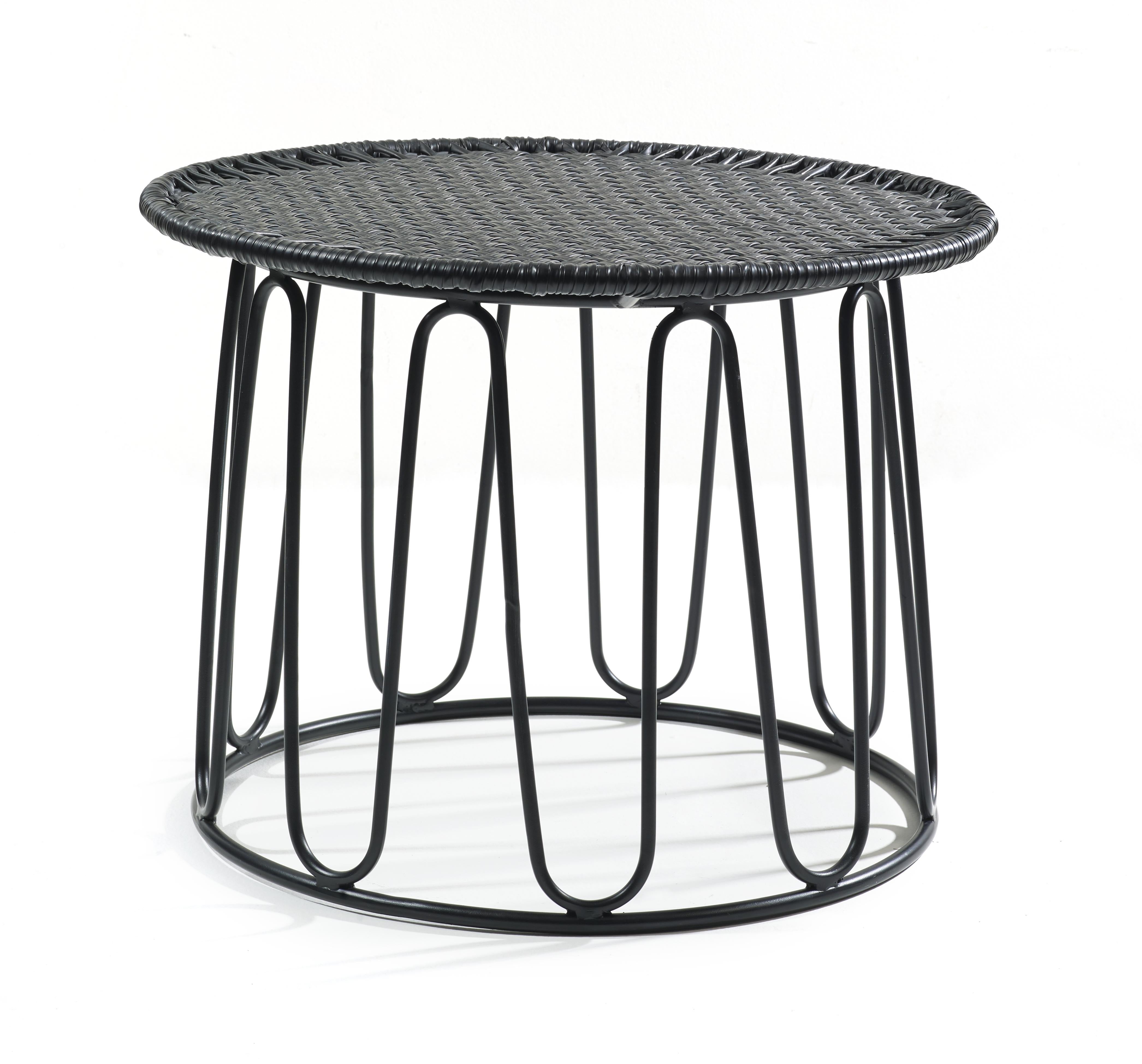 Black circo side table by Sebastian Herkner.
Materials: Galvanized and powder-coated tubular steel. PVC strings.
Technique: Made from recycled plastic. Weaved by local craftspeople in Colombia. 
Dimensions: 
Top diameter 55 cm 
Base diameter 51
