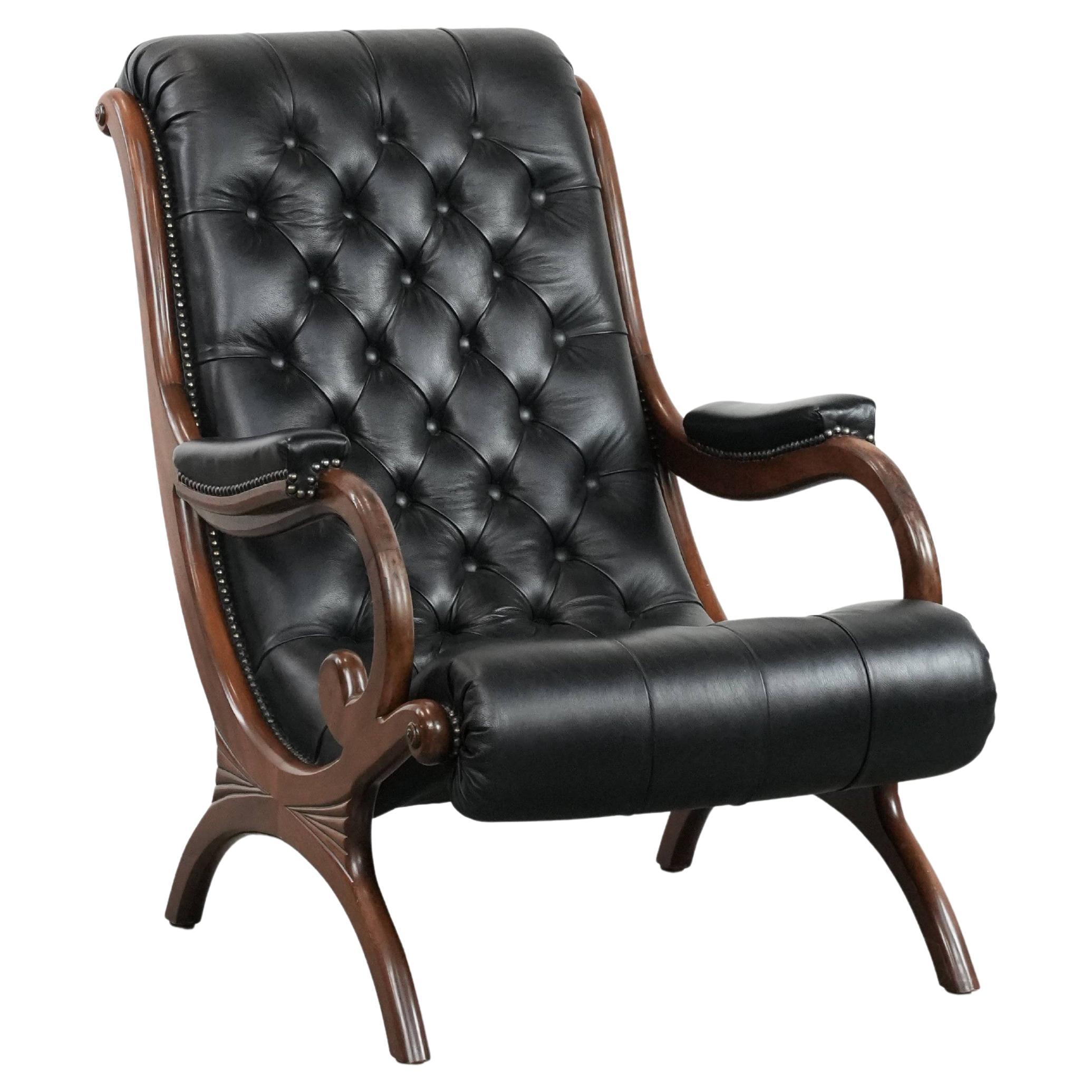Black classic and comfortable cowhide leather chesterfield armchair For Sale
