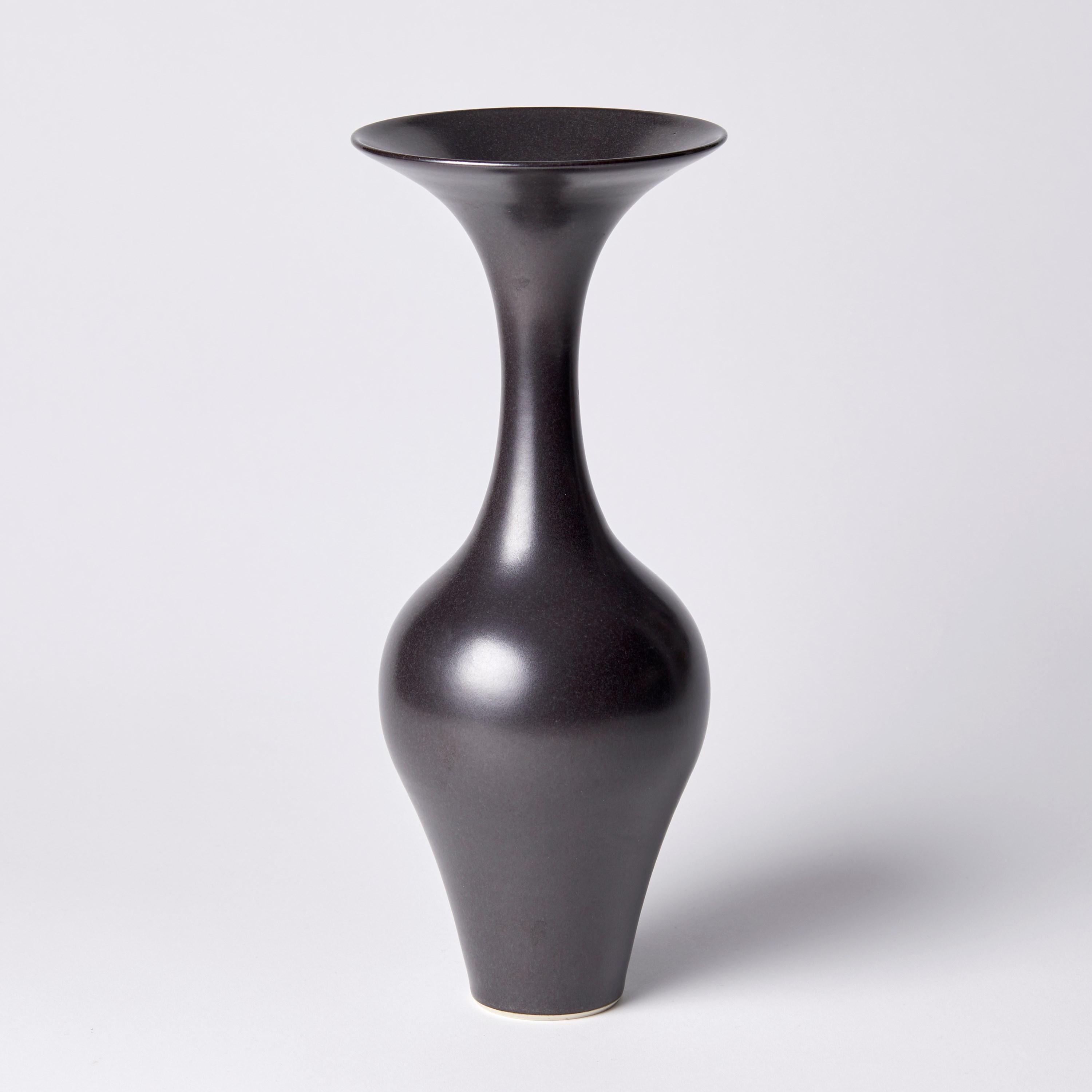 ‘Black Classic Vase I’ is a unique porcelain sculptural vessel by the British artist, Vivienne Foley, which has been released from her own personal archive of artworks. 

Vivienne Foley is based in Gloucestershire where she produces exquisite