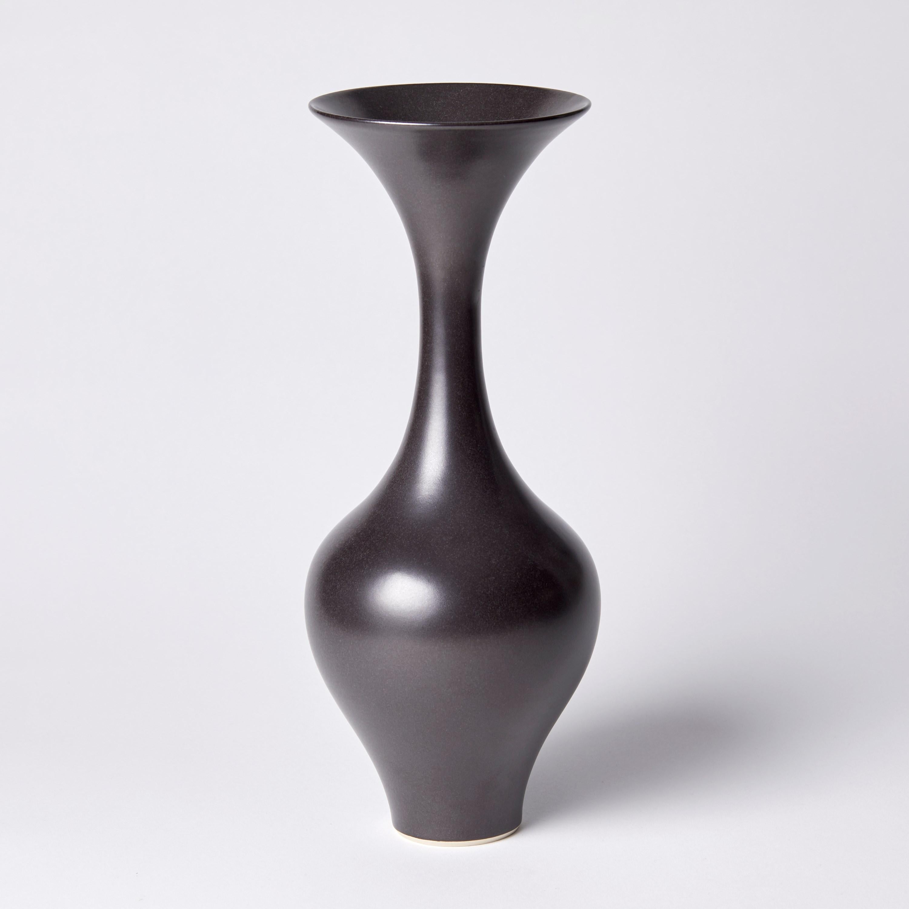 ‘Black classic vase II’ is a unique porcelain sculptural vessel by the British artist, Vivienne Foley, which has been released from her own personal archive of artworks. 

Vivienne Foley is based in Gloucestershire where she produces exquisite