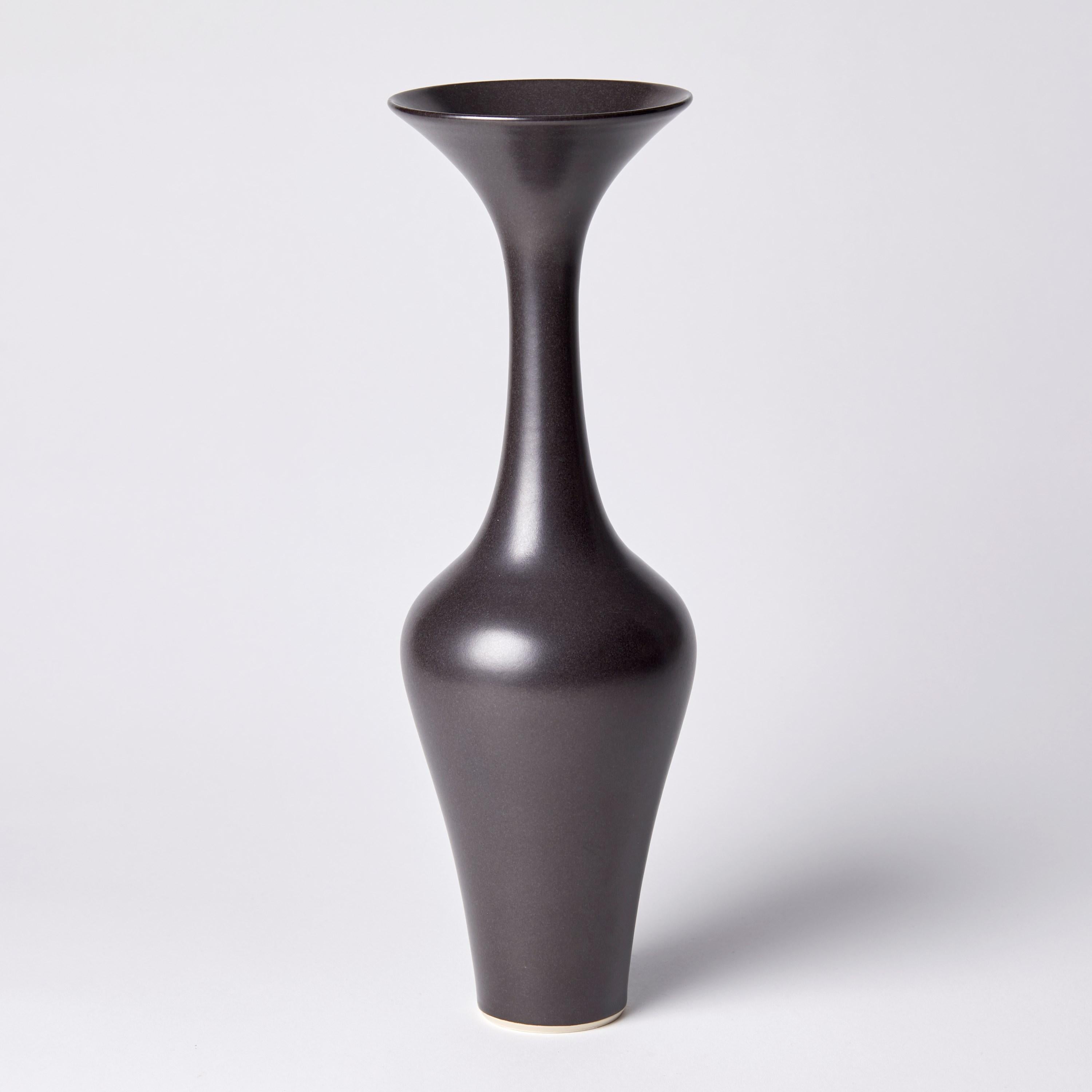 ‘Black Classic Vase III' is a unique porcelain sculptural vessel by the British artist, Vivienne Foley, which has been released from her own personal archive of artworks. 

Vivienne Foley is based in Gloucestershire where she produces exquisite