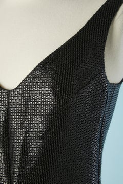 Vestido de cóctel negro de tejido brillante envolvente en la falda Carven