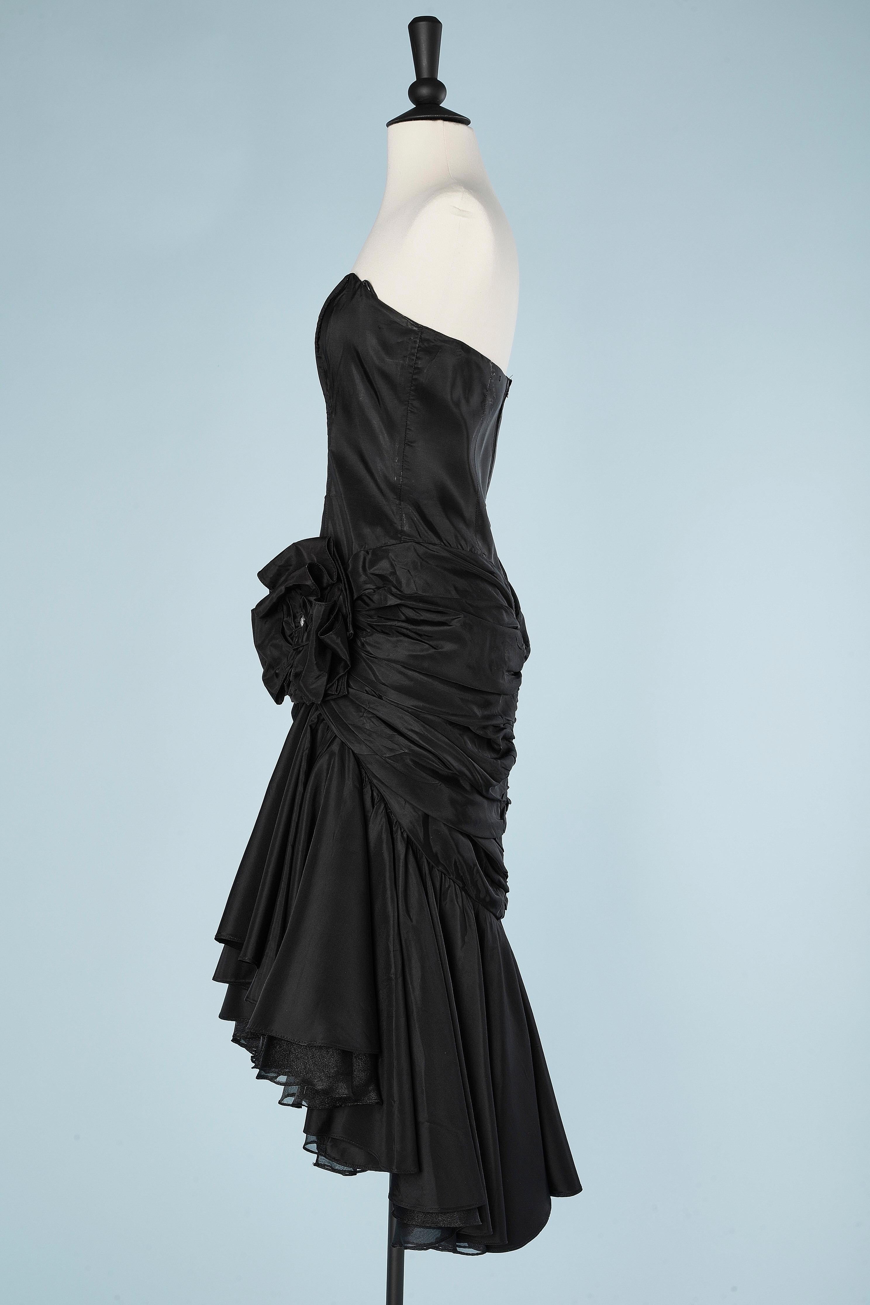 Black cocktail dress in taffetas with draped hips, bow and rhinestone ...
