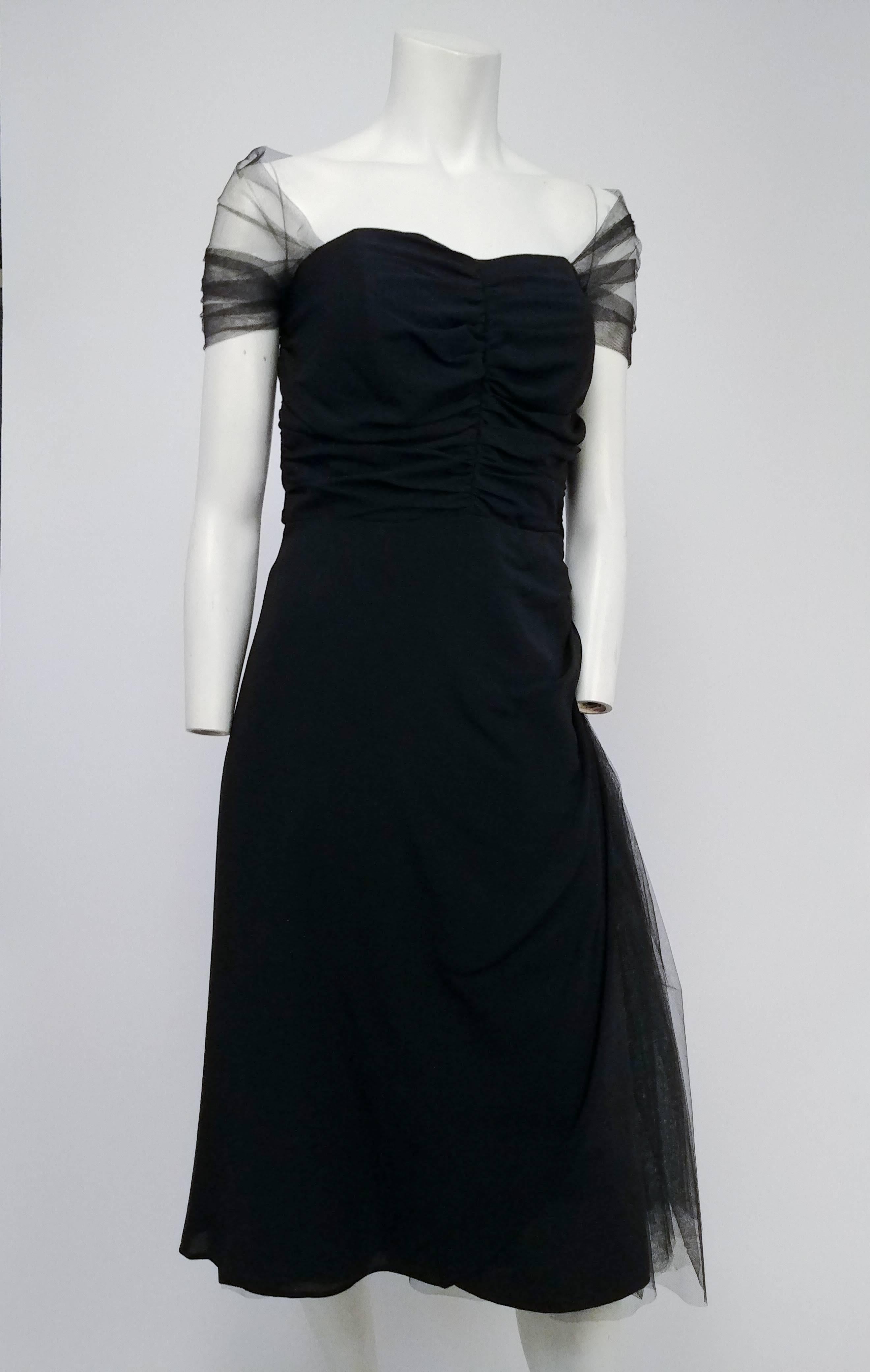 Black Cocktail Dress w/ Tulle Accents, 1950s. Gathered sweetheart neckline bodice with attached tulle shawl. Boned bodice. Asymmetric tulle detail gathered on one side of skirt. 