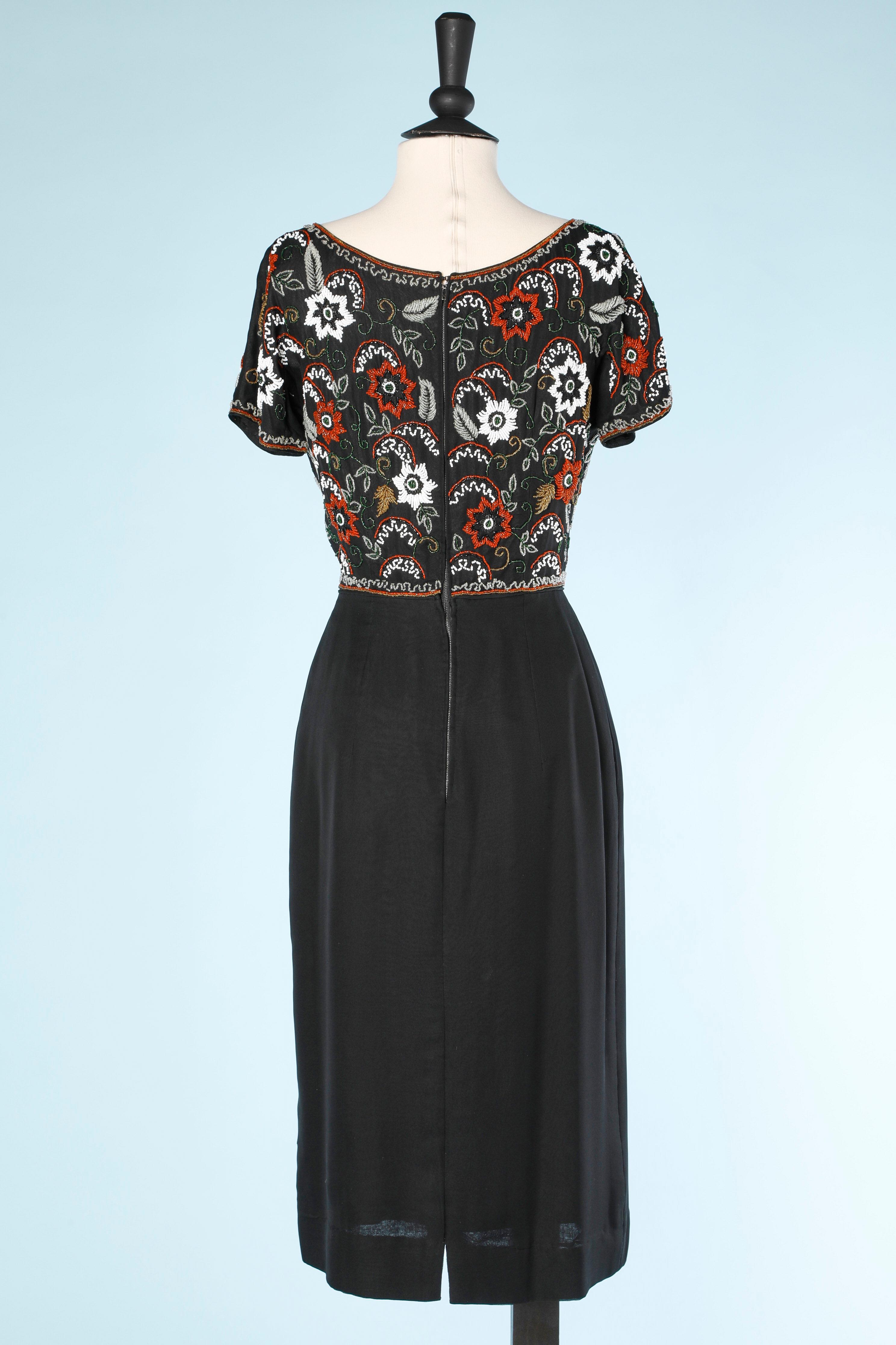 Women's Black cocktail dress with beaded work un the bust Circa 1960's  For Sale