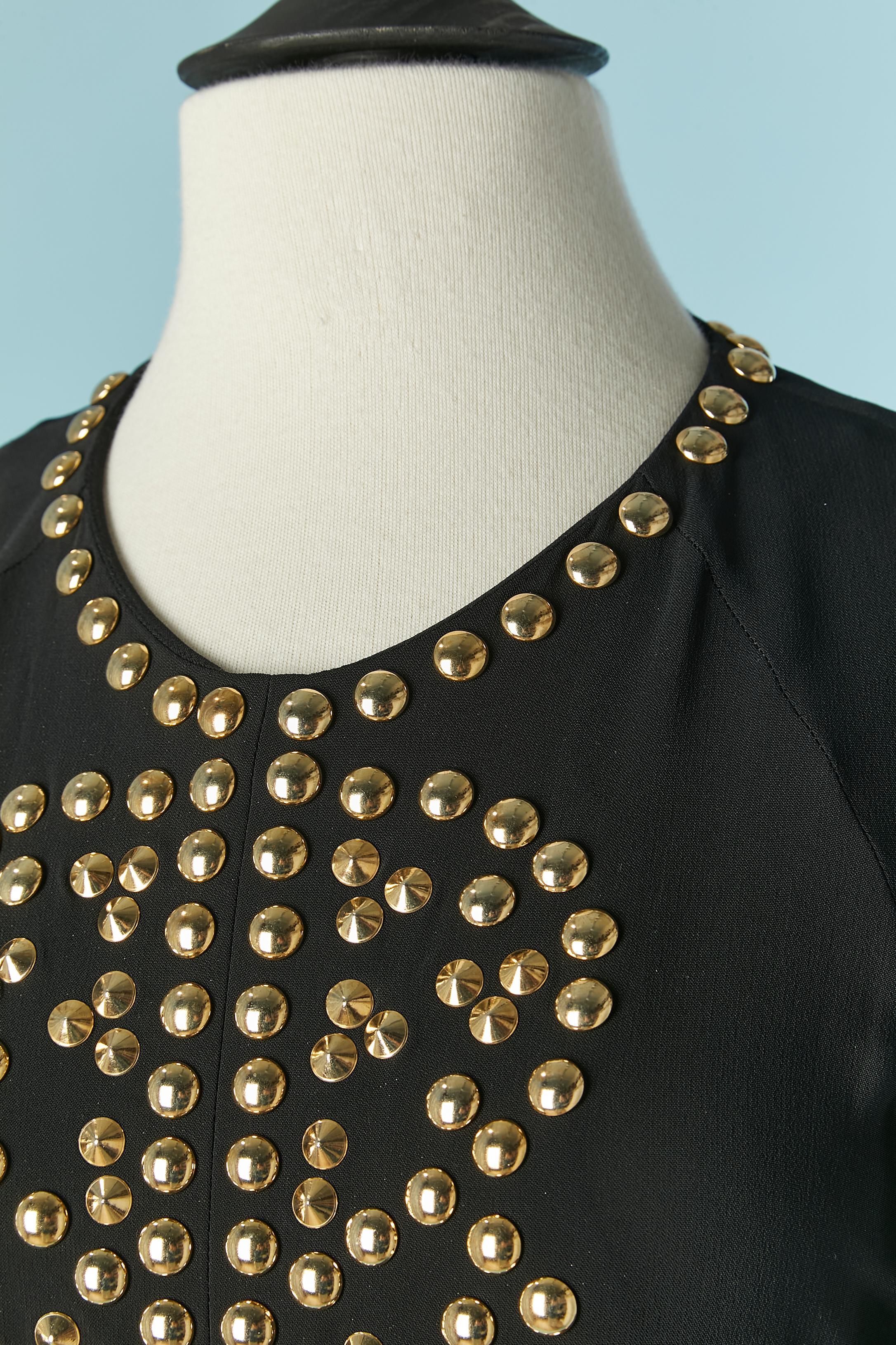 Black cocktail dress with gold metal copper studs. Fabric composition: 95% rayon, 5% nylon stretch 
Raglan sleeve. Zip closure on the middle back + hook&eye . 
SIZE 38 / M 