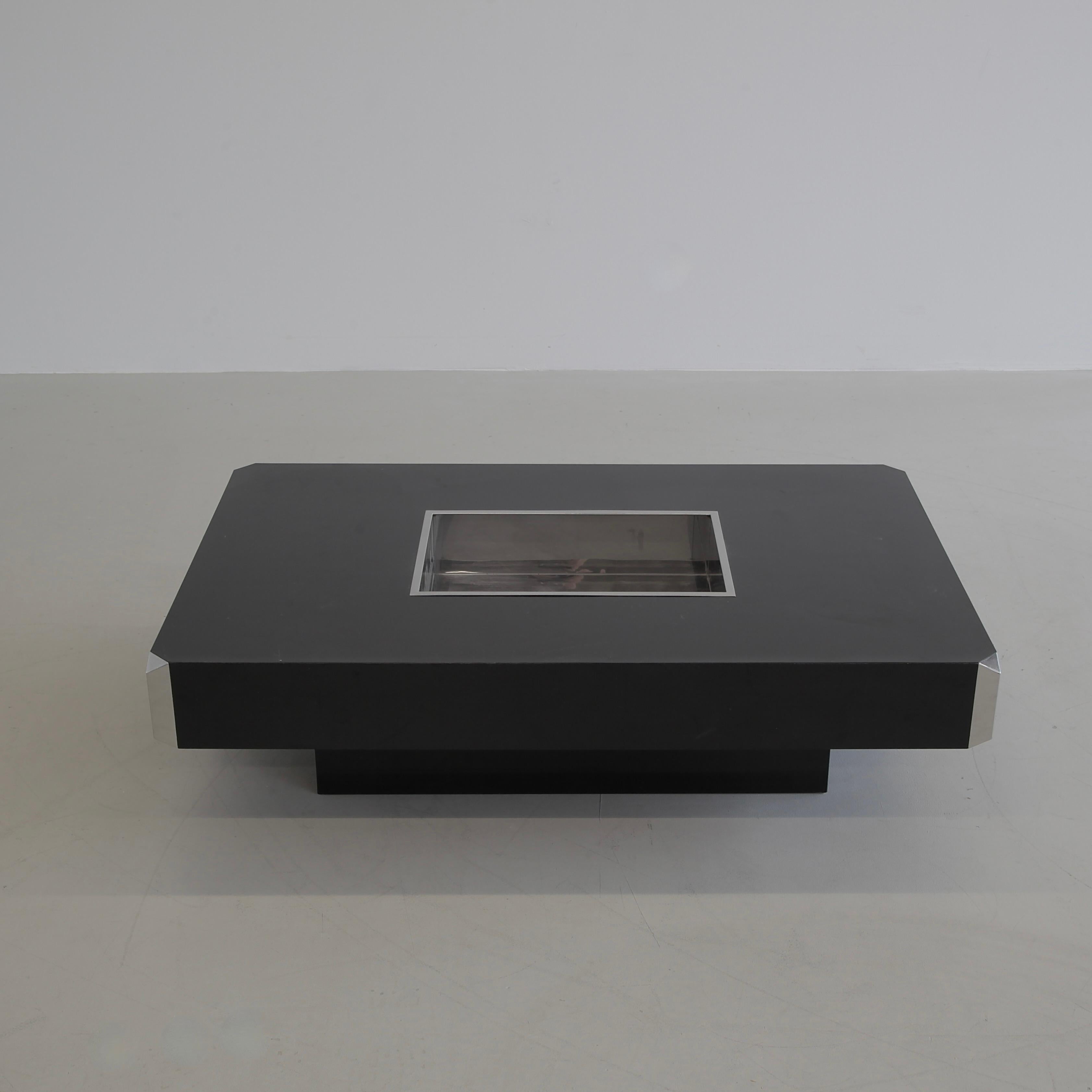 Coffee table, designed by Willy Rizzo. Italy, Mario Sabot, Manzano (Udine) 1974.

Model: Alveo, black Formica covered wooden table construction with inserted stainless steel tray/ bucket and chromed corner pieces. This is the classic Willy Rizzo