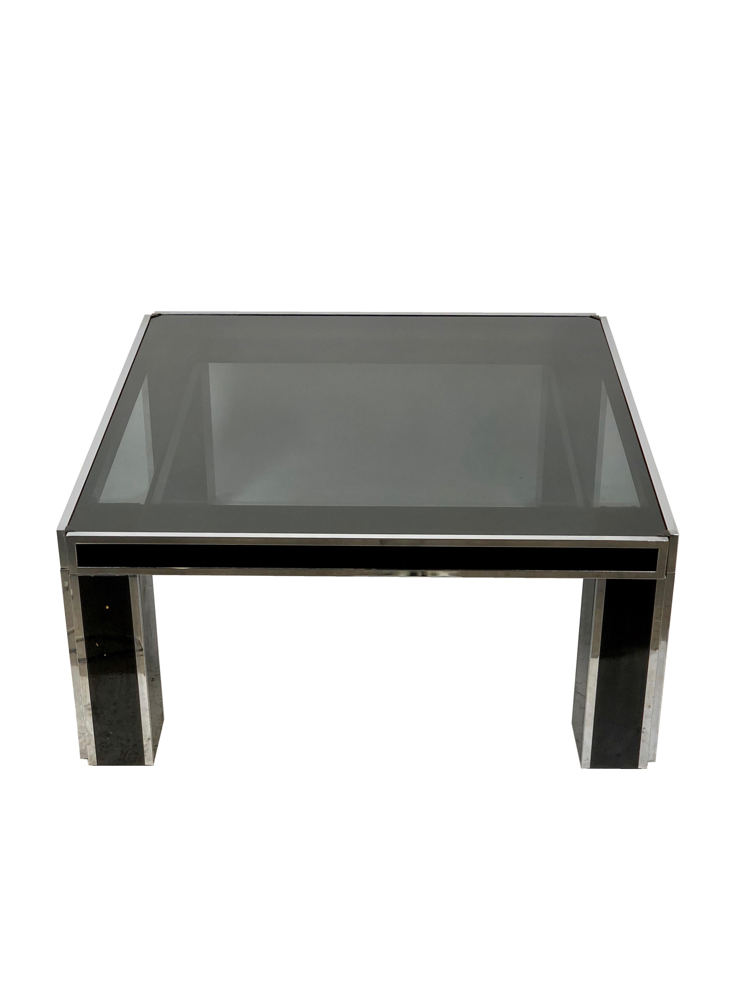 Coffee table in Romeo Rega style made of chrome coated in black and smoked glass, Italy, circa 1970.