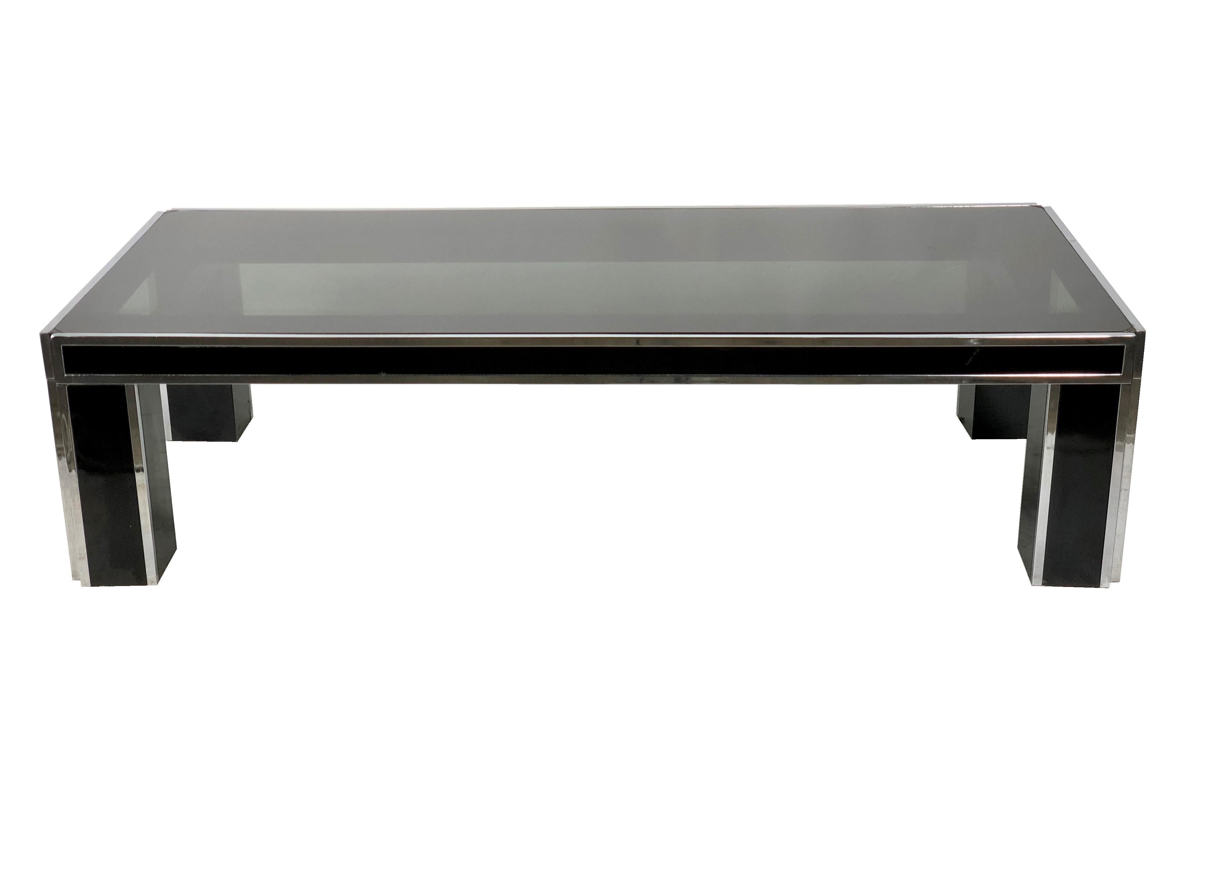 Rectangular coffee table in Romeo Rega style made of chrome coated in black and smoked glass, Italy, circa 1970.