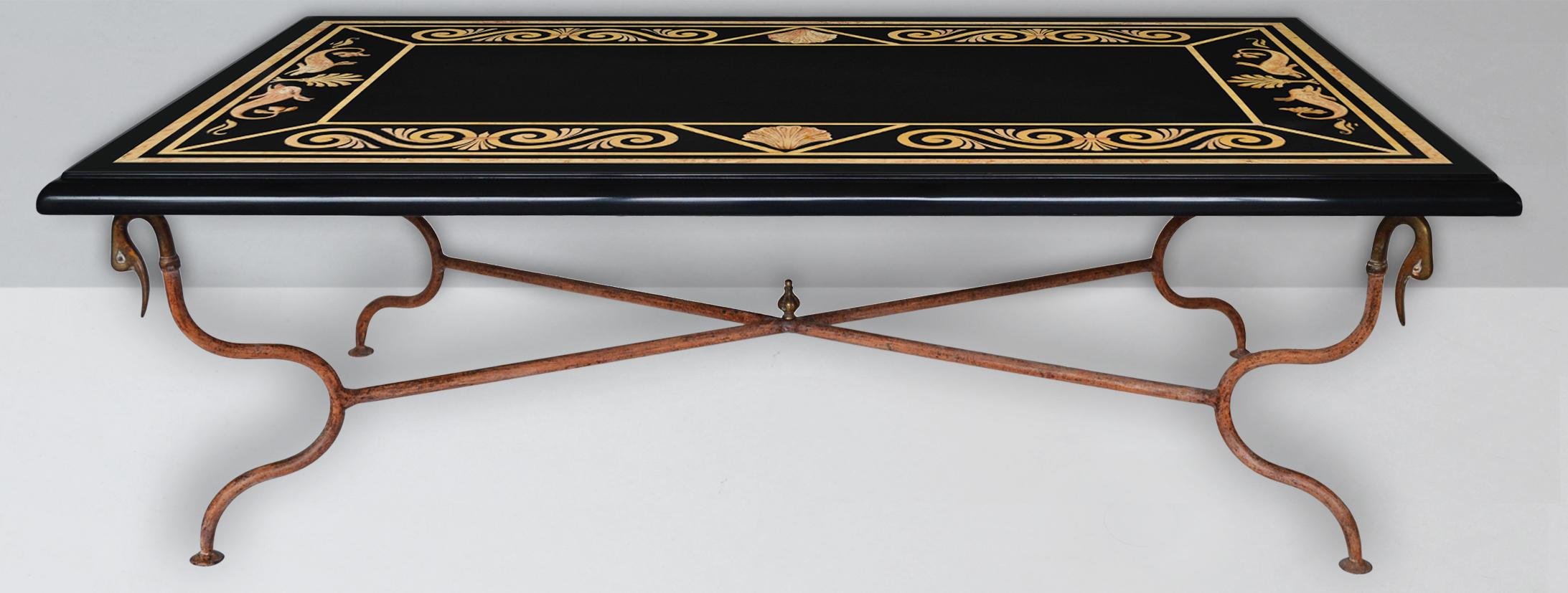 Black coffee table slate top scagliola art inlays whrought metal base and brass.
Showcasing an artistic  and refined design exquisitely handcrafted  on a black
slate , this coffee table will make a  stately addition to a modern decor. Its sleek