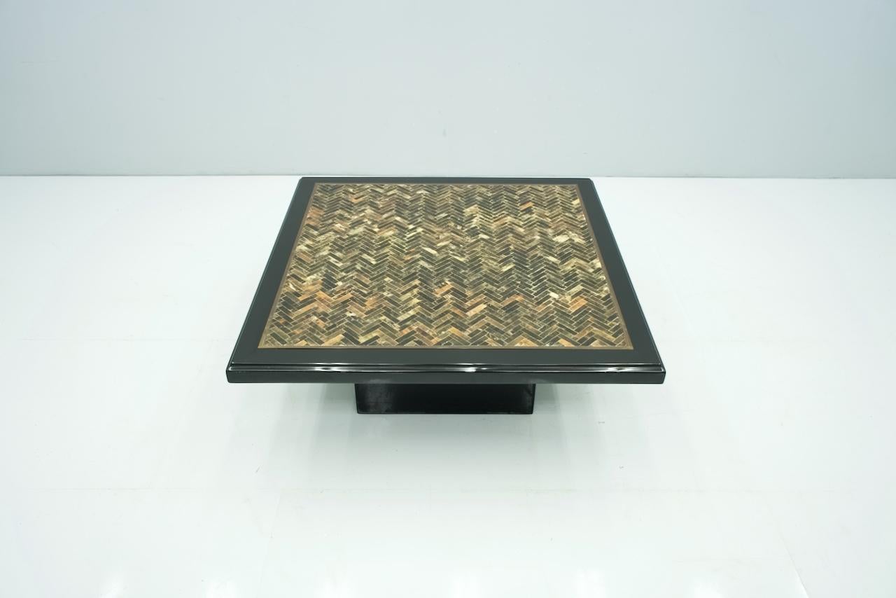 Black coffee table with brown and black horn inlays framed in a brass frame. The base and the edge are with black lacquer. The table dates back to France in the 1970s,
A very beautiful table!

Details:

Creator: unknown
Period: 1970s
Color: