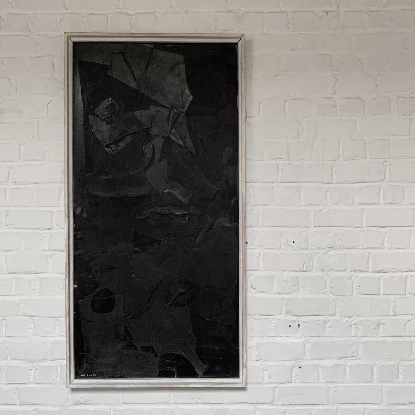 This must be one of Hans Osswald best works. We have several in our collection. This black one is made of different materials and creates an interesting relief. oil painted black with different shades of black depending on where you are looking at.