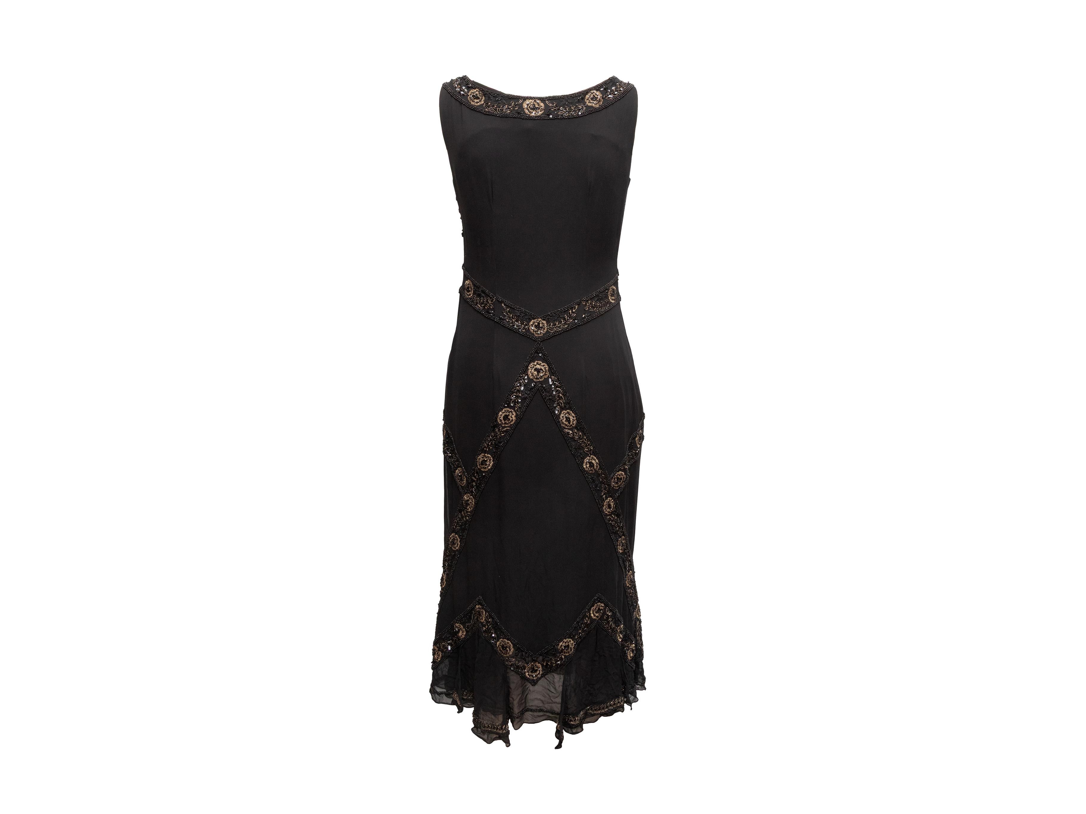 Black silk sleeveless bead-embellished dress by Collette Dinnigan. V-neck. Zip closure at side. 34